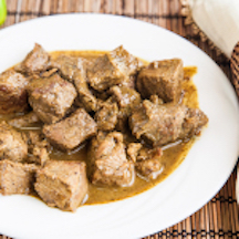 Order Curry Beef with Roti food online from Limins Cafe Caribe store, East Orange on bringmethat.com
