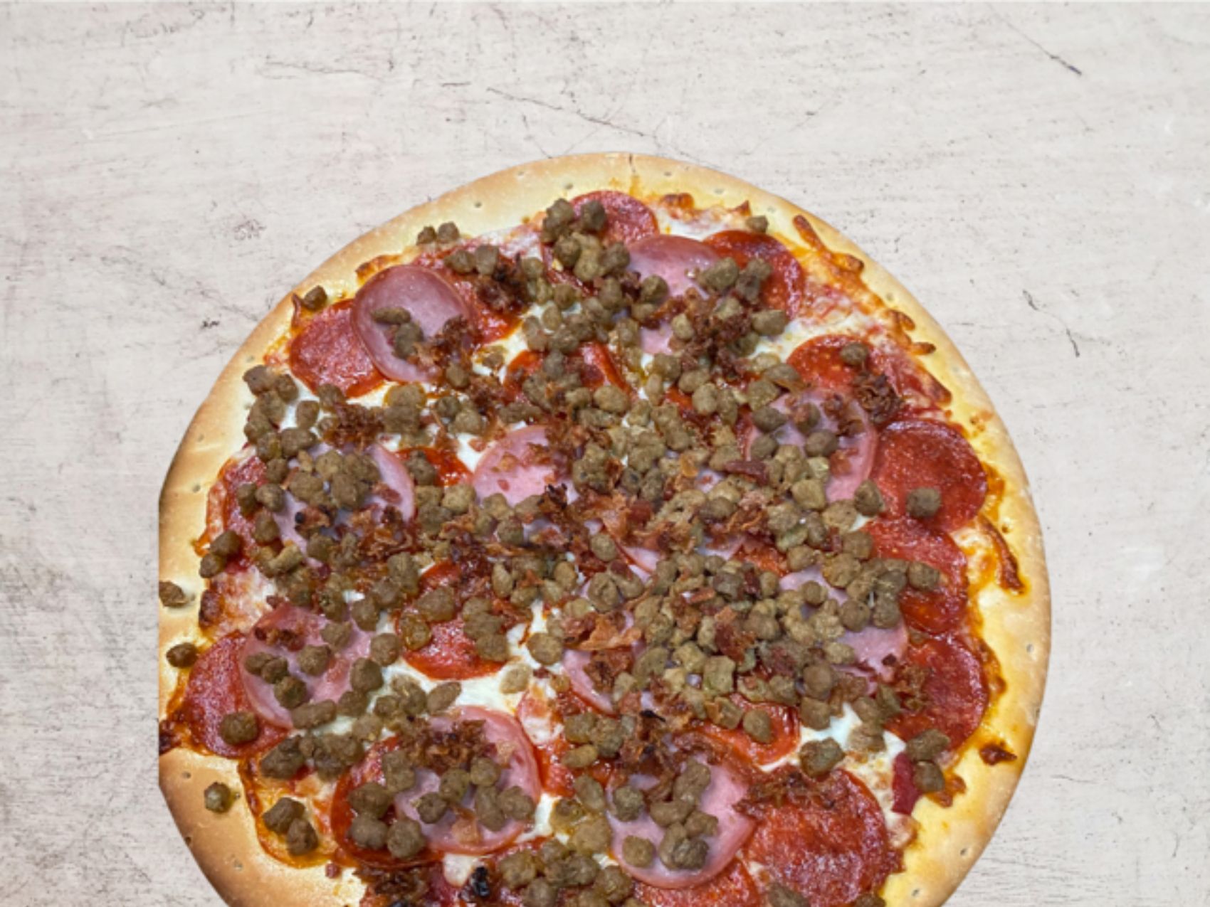 Order Meat Lovers Pizza* food online from The Slice Pizzeria store, San Antonio on bringmethat.com