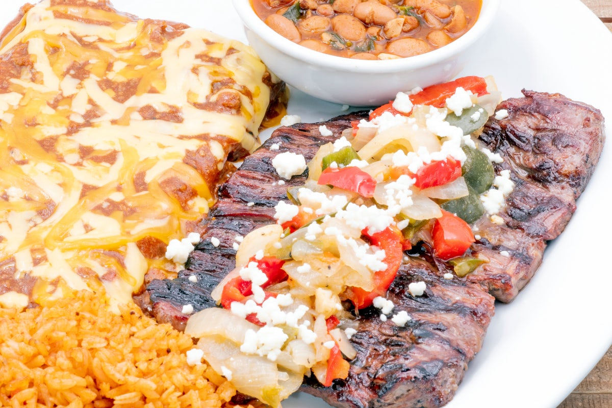 Order Steak & Enchilada Dinner food online from Uncle Julios Fine Mexican Foods store, Dallas on bringmethat.com