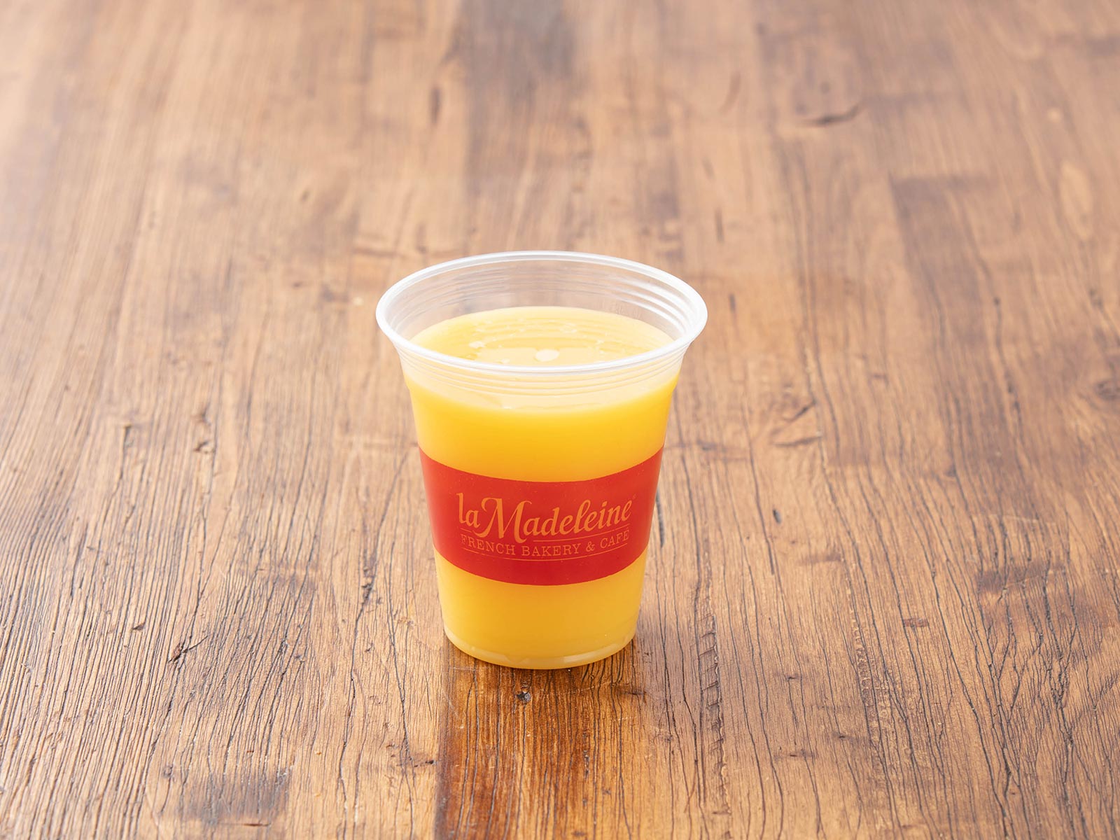 Order Orange Juice food online from La Madeleine Bakery Cafe & Bistro store, New Orleans on bringmethat.com