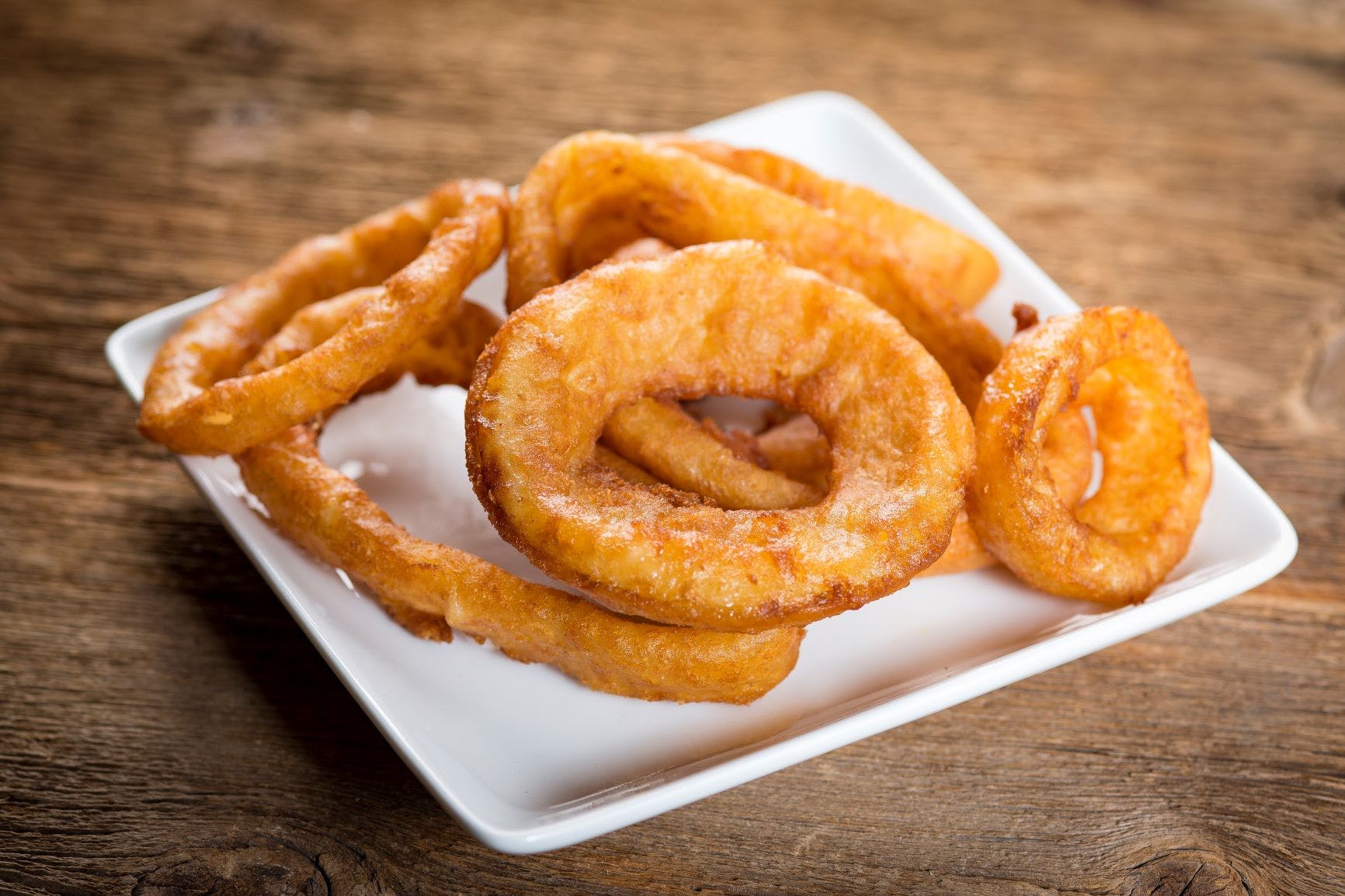 Order Onion Rings - Appetizer food online from Papa Saverio's Pizza store, Geneva on bringmethat.com