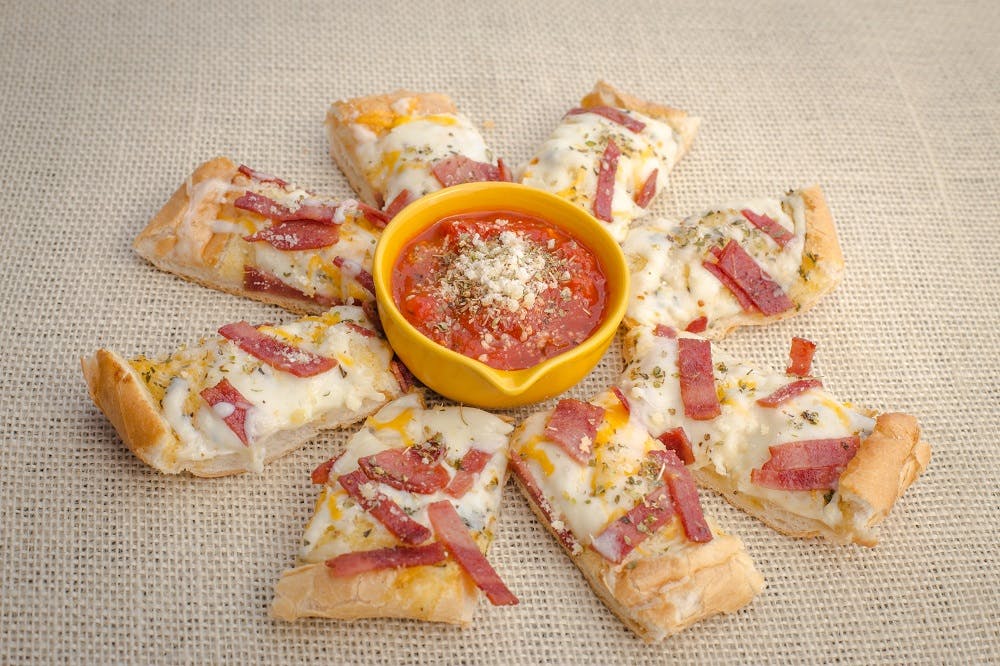 Order Garlic Bread with Bacon & Cheese - Appetizer food online from La Casa De Pizzeria store, Troy on bringmethat.com