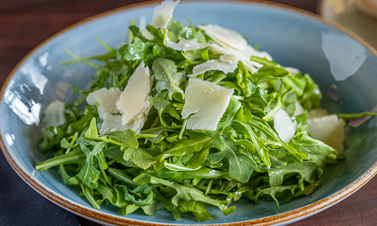 Order Arugula Salad food online from Russo's Pizza store, Austin on bringmethat.com