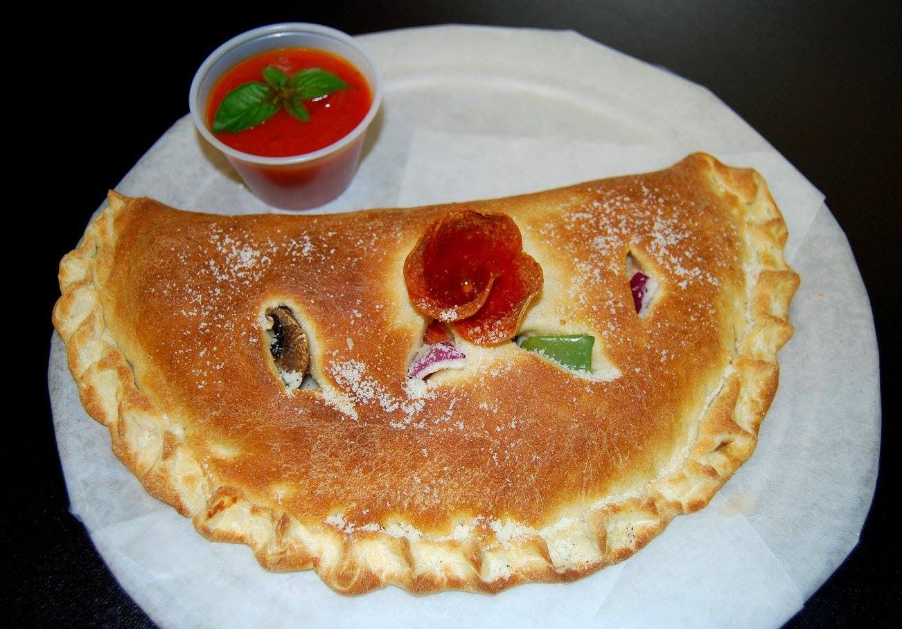 Order Meat Lover's Calzone - Small food online from Apollos Pizza store, Richmond on bringmethat.com