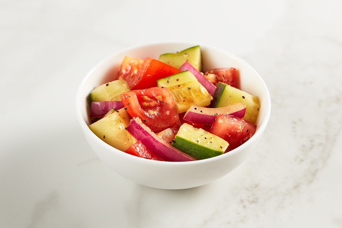 Order Tomato & Cucumber Salad food online from McAlister's Deli store, Fayetteville on bringmethat.com
