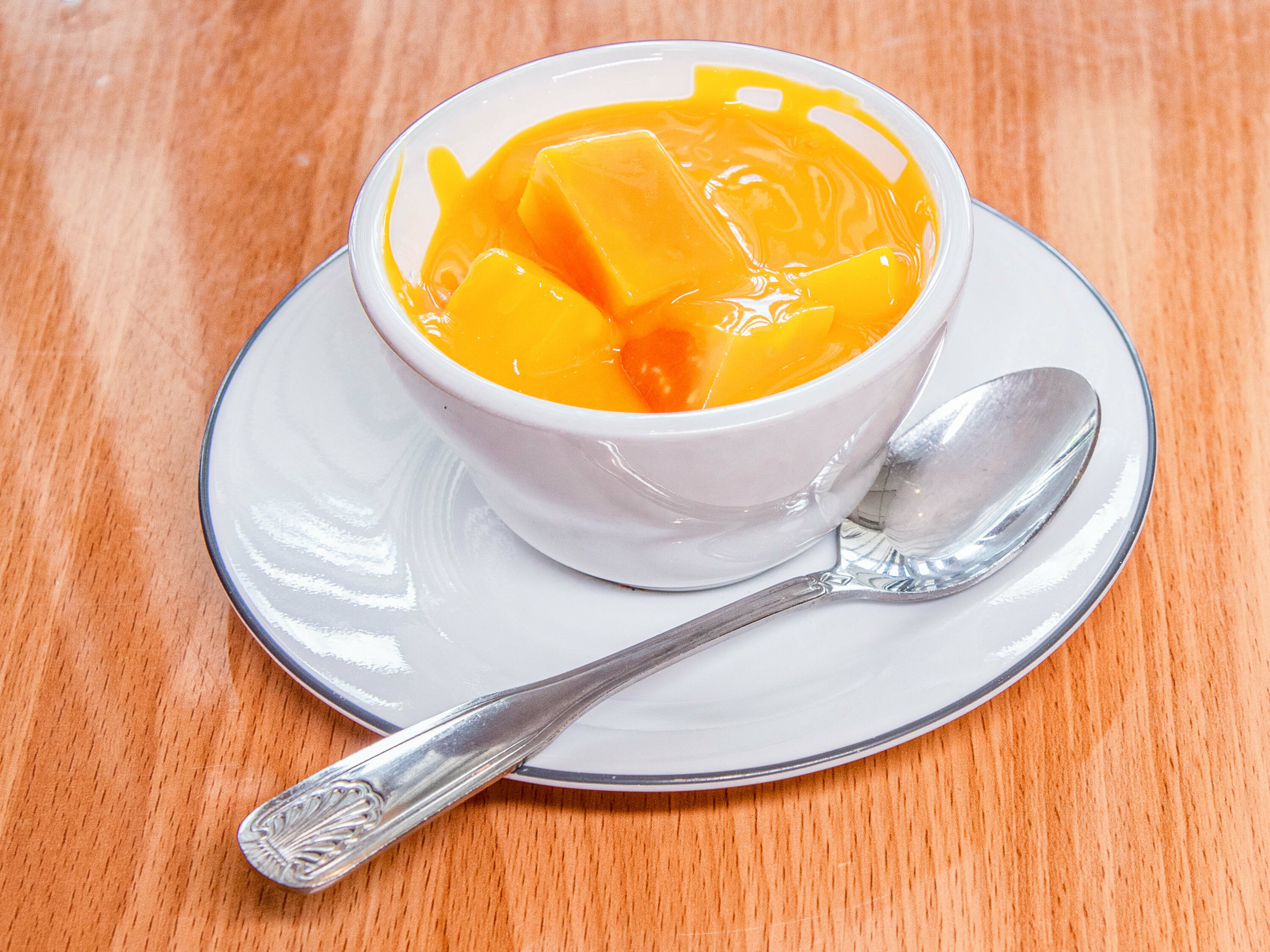 Order 39. Mango Pudding food online from India House Restaurant store, Michigan City on bringmethat.com