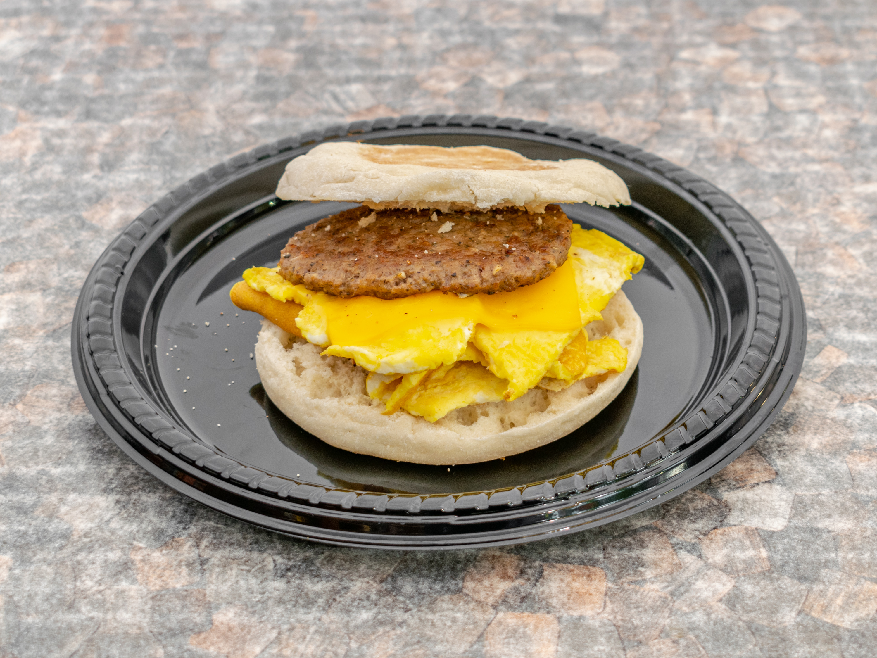 Order Sausage, Egg and Cheese Sandwich food online from America's finest deli store, New York on bringmethat.com