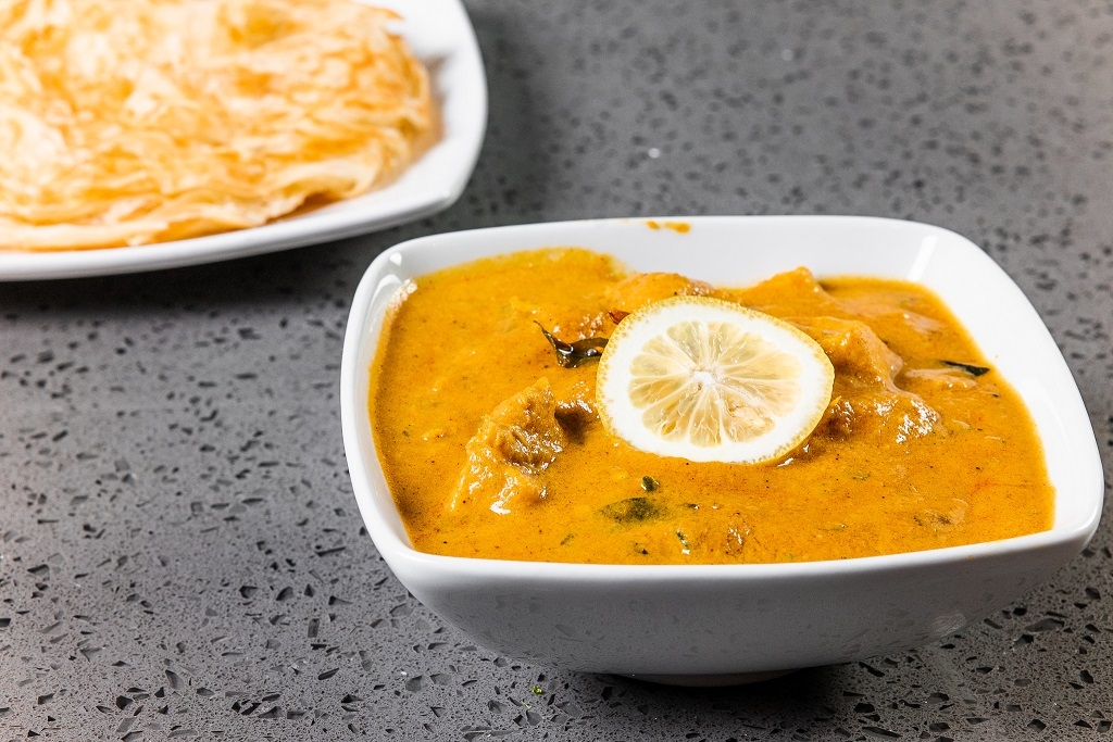 Order Parota - Chicken Kurma food online from Lime & Lemon Indian Grill store, Raleigh on bringmethat.com