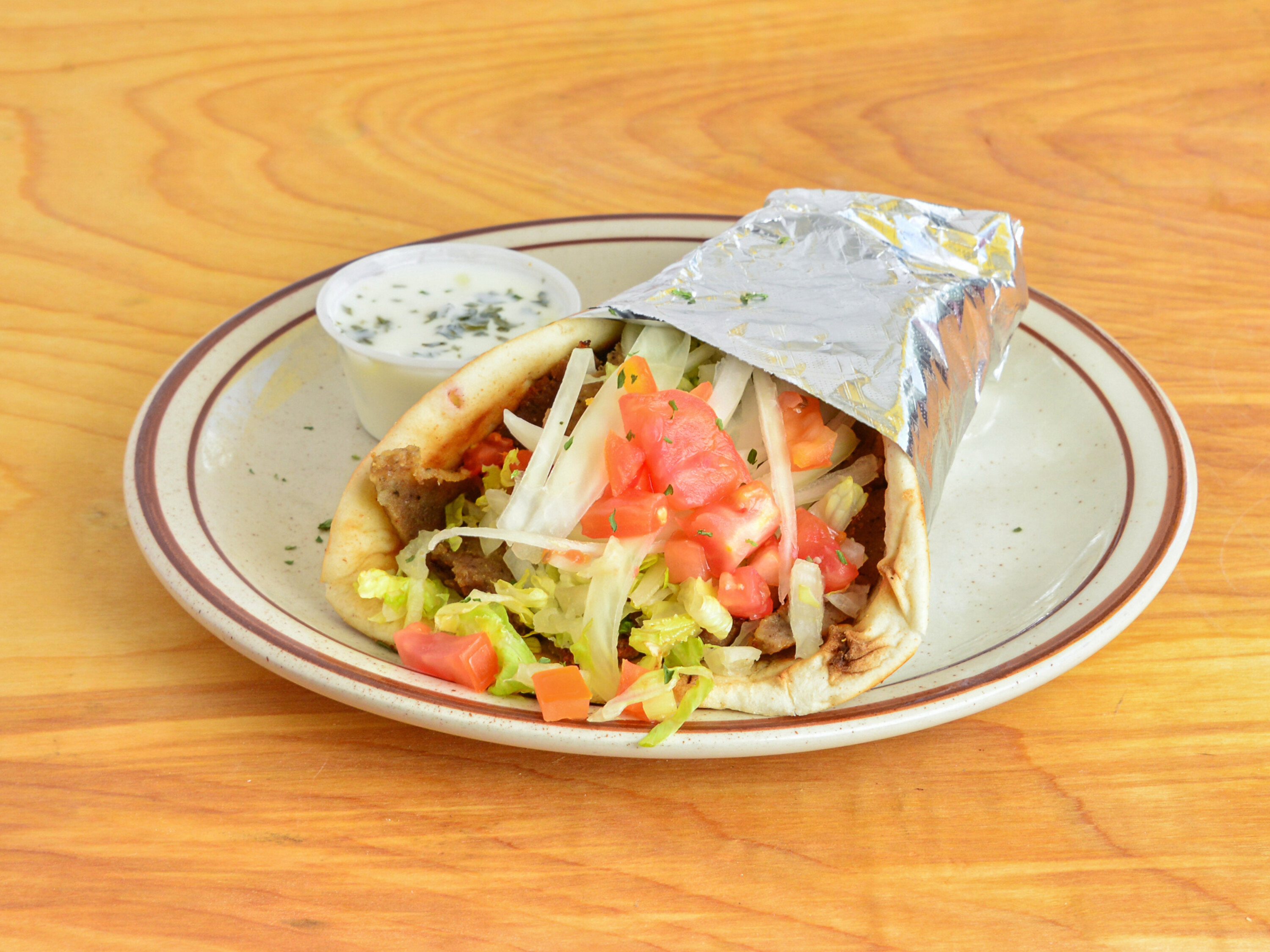 Order Greek Gyro food online from Sidewalk Cafe store, Painesville on bringmethat.com