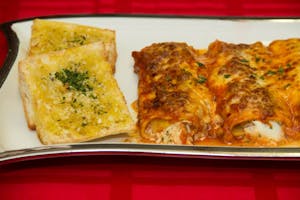 Order Manicotti Florentine (Vegetarian) food online from Papa Ray's Pizza - Miriam St. store, Daly City on bringmethat.com