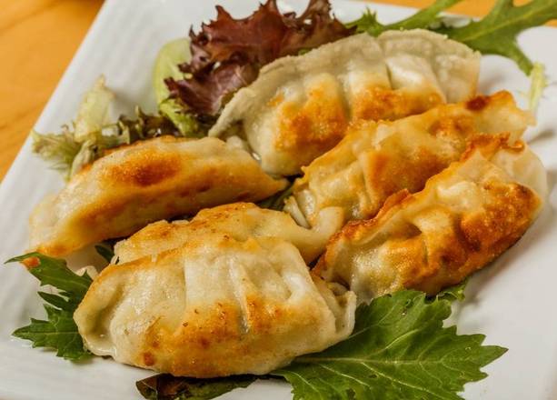 Order Pan-Fried Gyoza (6 pcs) food online from Fusion Cafe store, Metairie on bringmethat.com