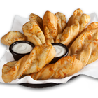 Order Garlic Parmesan Twists food online from Round Table Pizza store, Los Gatos on bringmethat.com