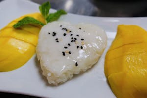 Order Mango with Sticky Rice(Seasonal) food online from Tamarind Thai Cuisine store, Camarillo on bringmethat.com