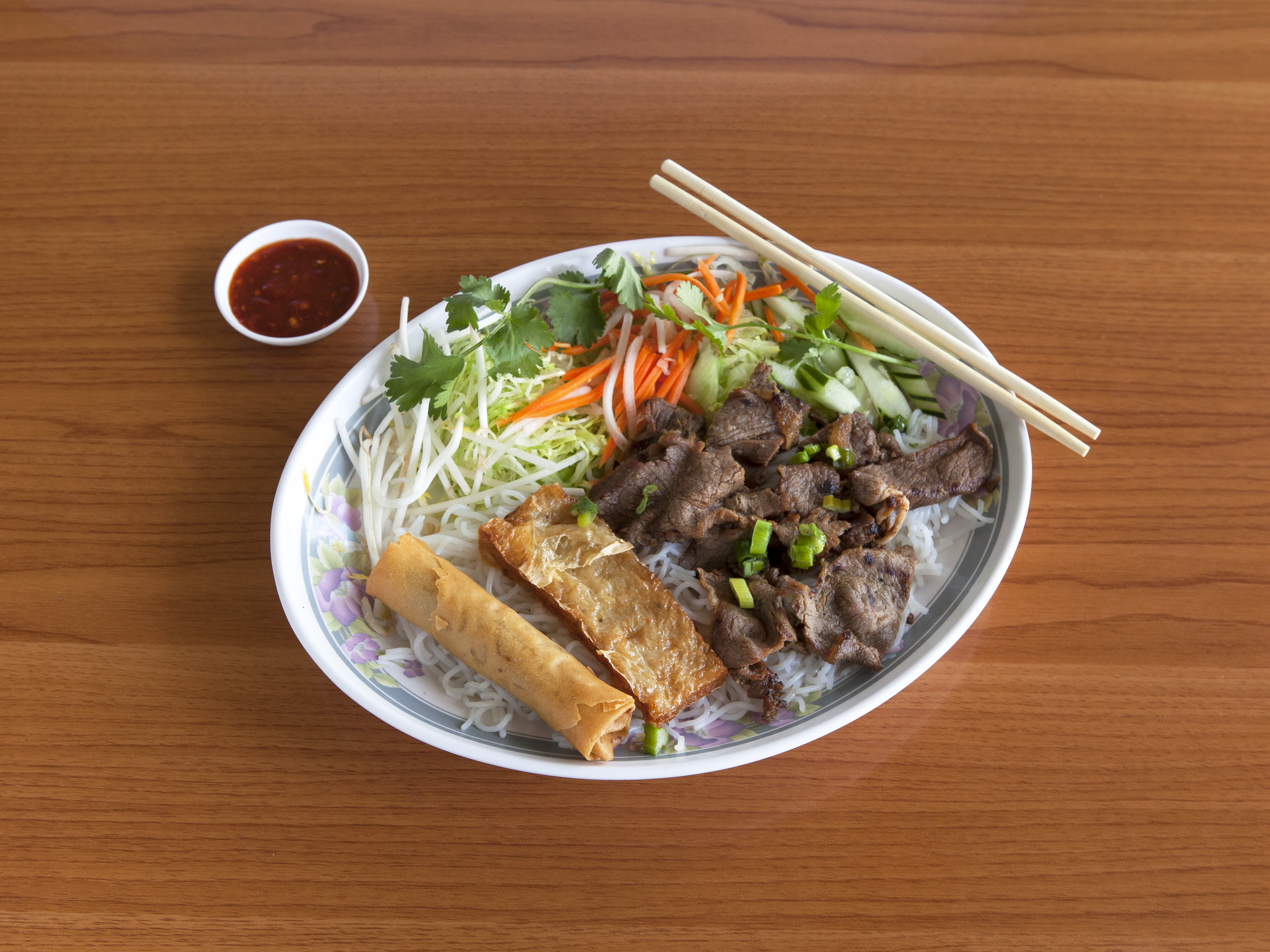 Order 64. Grilled Pork Vermicelli, Shrimp Cakes and Egg Roll food online from Pho Kobe store, Torrance on bringmethat.com