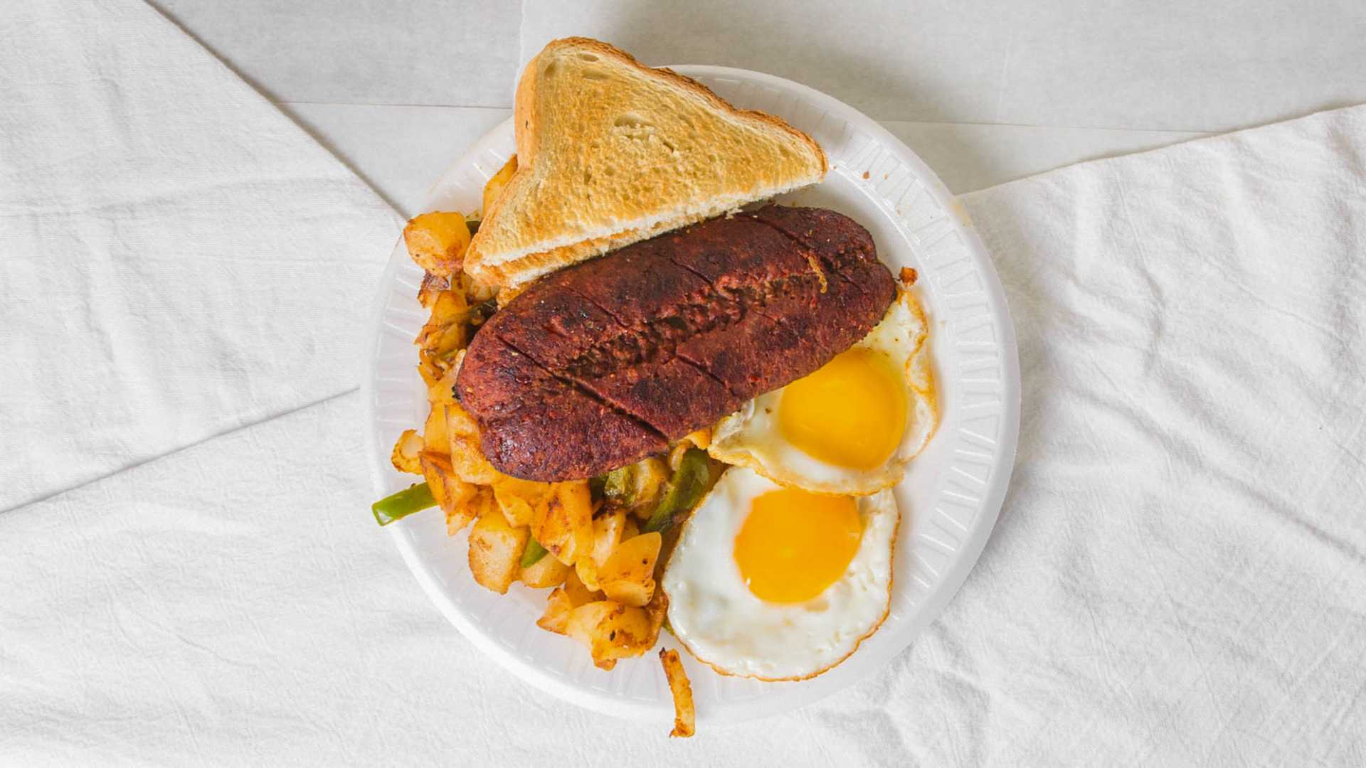 Order 2 Eggs, Beef Bacon, Home Fries and Toast food online from Shop & Go Deli store, Elizabeth on bringmethat.com