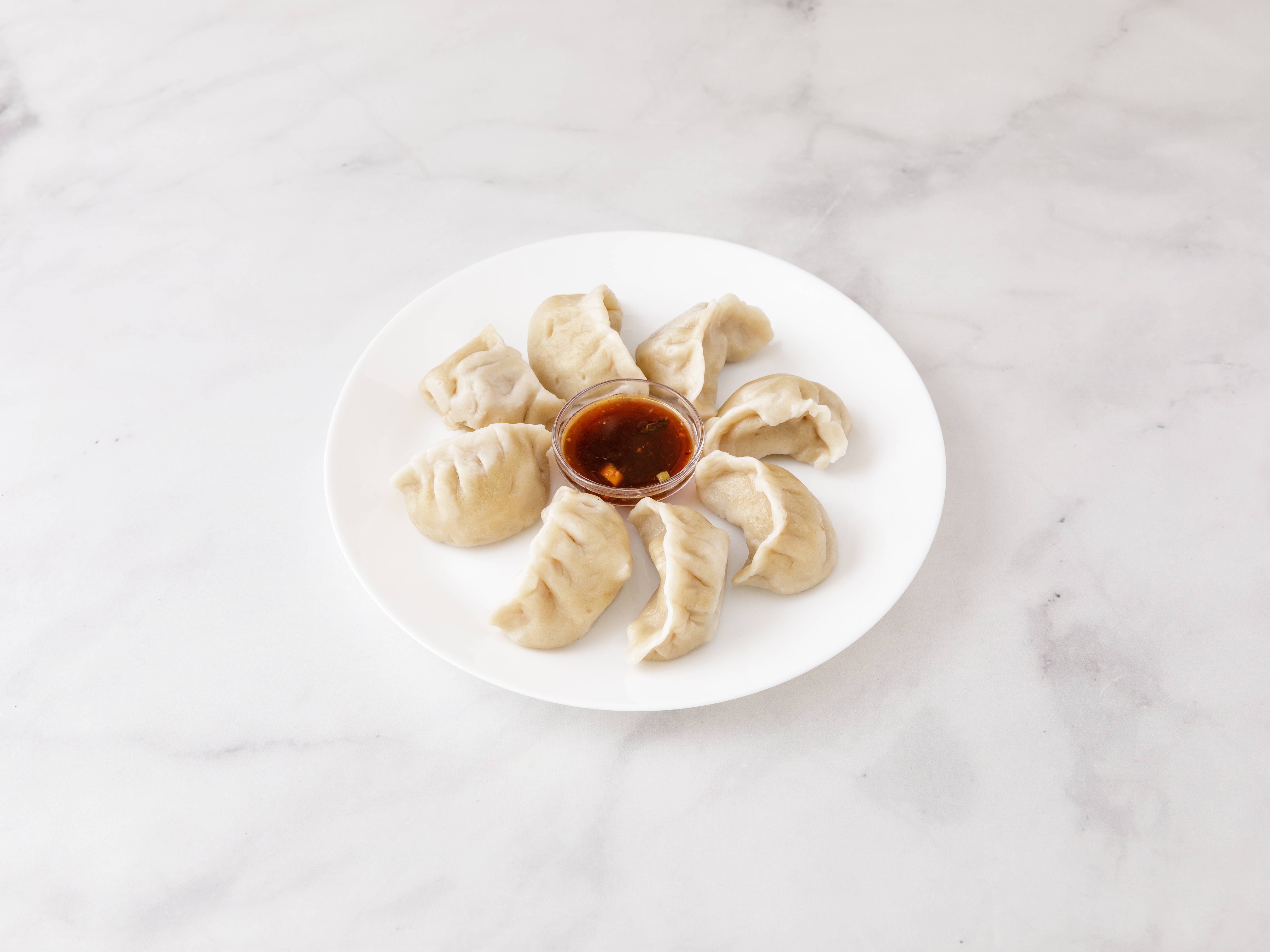 Order 1. Eight Steamed Pork Dumplings food online from Chinatown Kitchen store, Teaneck on bringmethat.com
