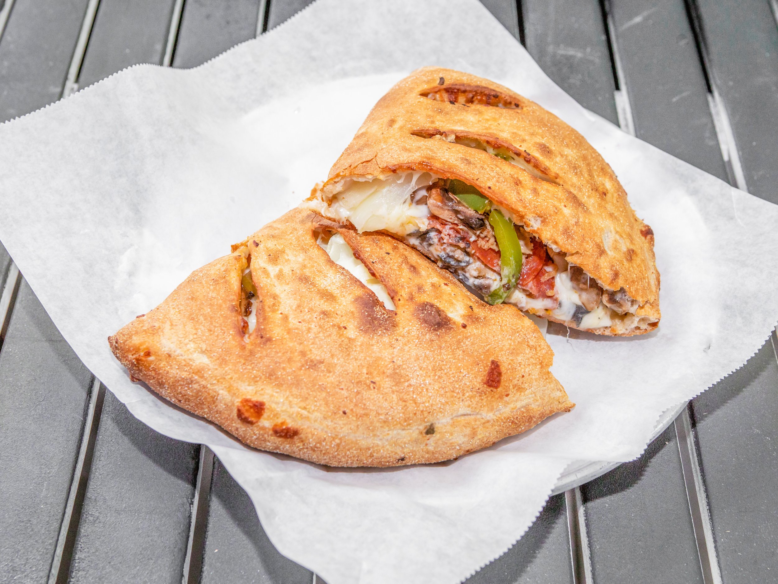 Order Ricotta Mozzarella Calzone food online from Ameci Pizza Kitchen store, Brentwood on bringmethat.com