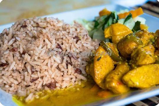 Order Organic Curry Chicken food online from Footprints Jamaican Restaurant & Lounge store, Decatur on bringmethat.com