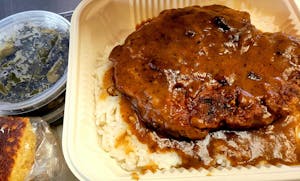 Order (MONDAYS ONLY) Smothered Pork Chop(s) food online from Nauling Texas Bbq & Soul Food store, Topeka on bringmethat.com