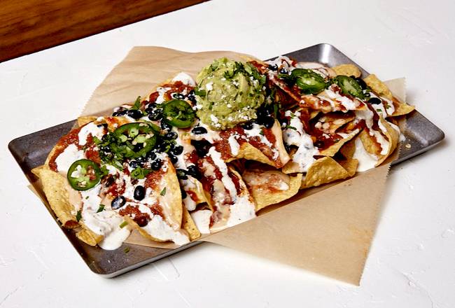 Order Chili + Queso Loaded Nachos food online from TownHall store, Cleveland on bringmethat.com