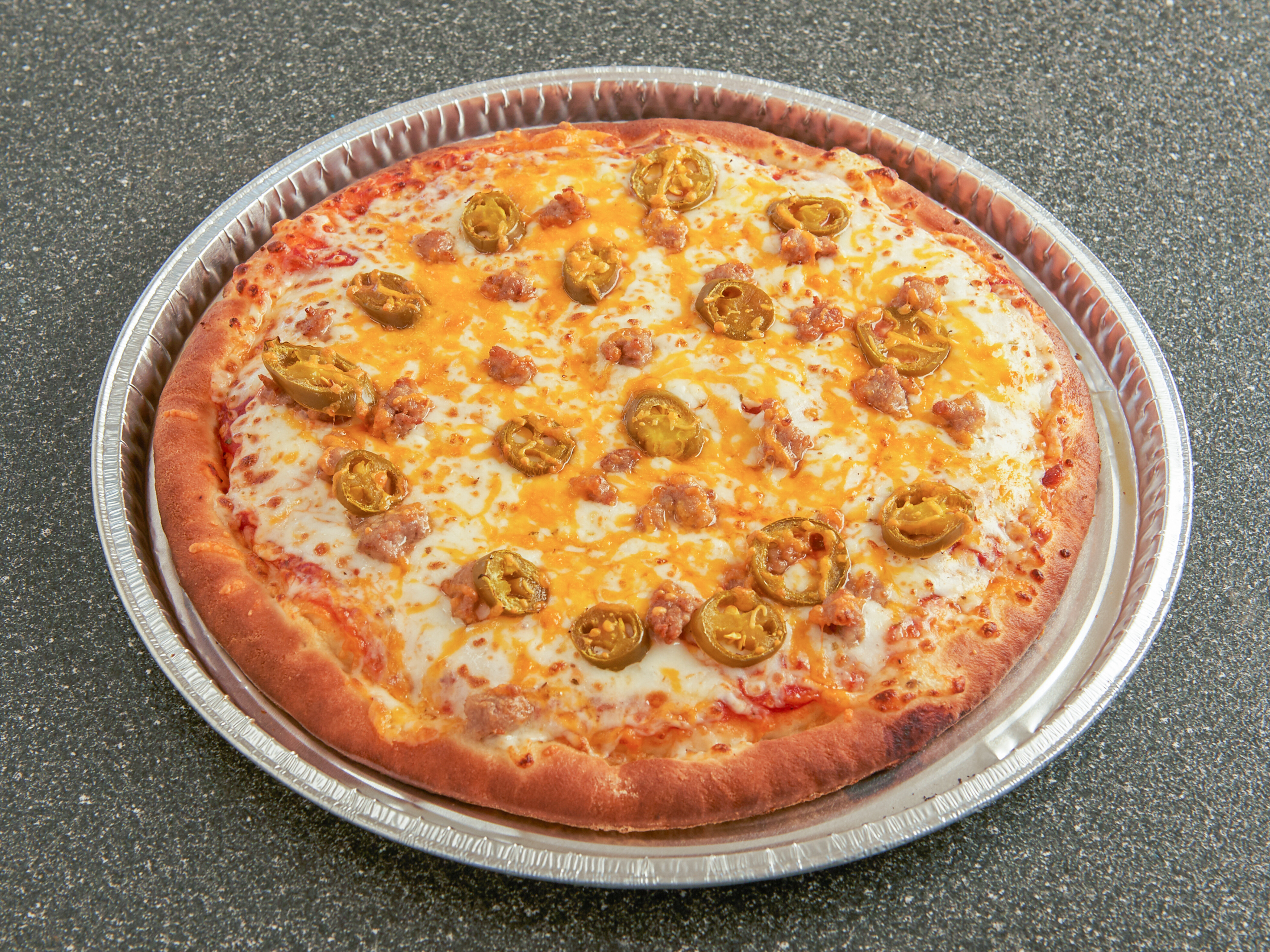 Order Spicy Sausage Jalapenos Specialty Pizza food online from Noble Romans store, Crawfordsville on bringmethat.com