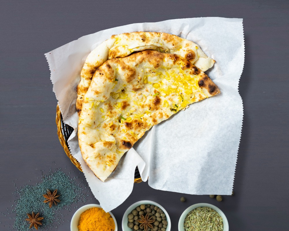 Order Garlic Naan food online from Master Of Naan store, Tempe on bringmethat.com