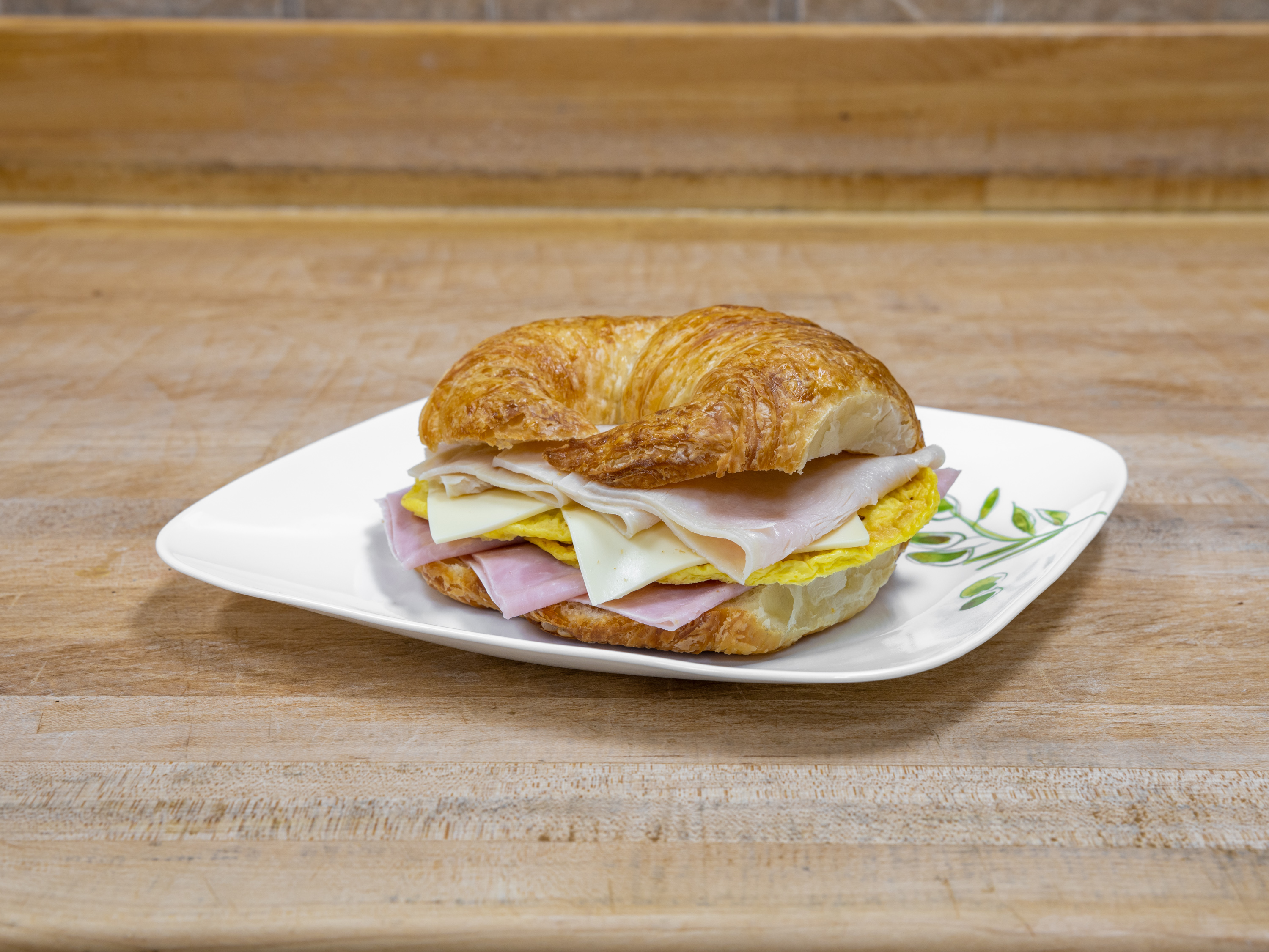 Order B-9 Turkey & Ham & Egg & Cheese Croissant food online from K-Inn Donuts store, Paramount on bringmethat.com