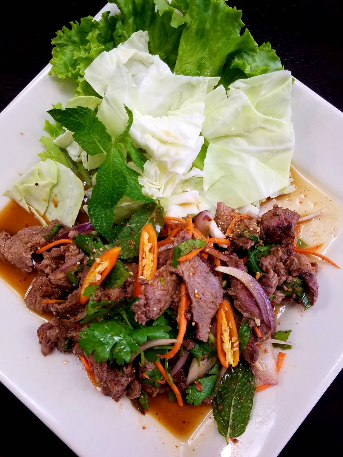 Order 21. Nam Tok Beef Salad food online from Sizzling Wok store, Long Beach on bringmethat.com