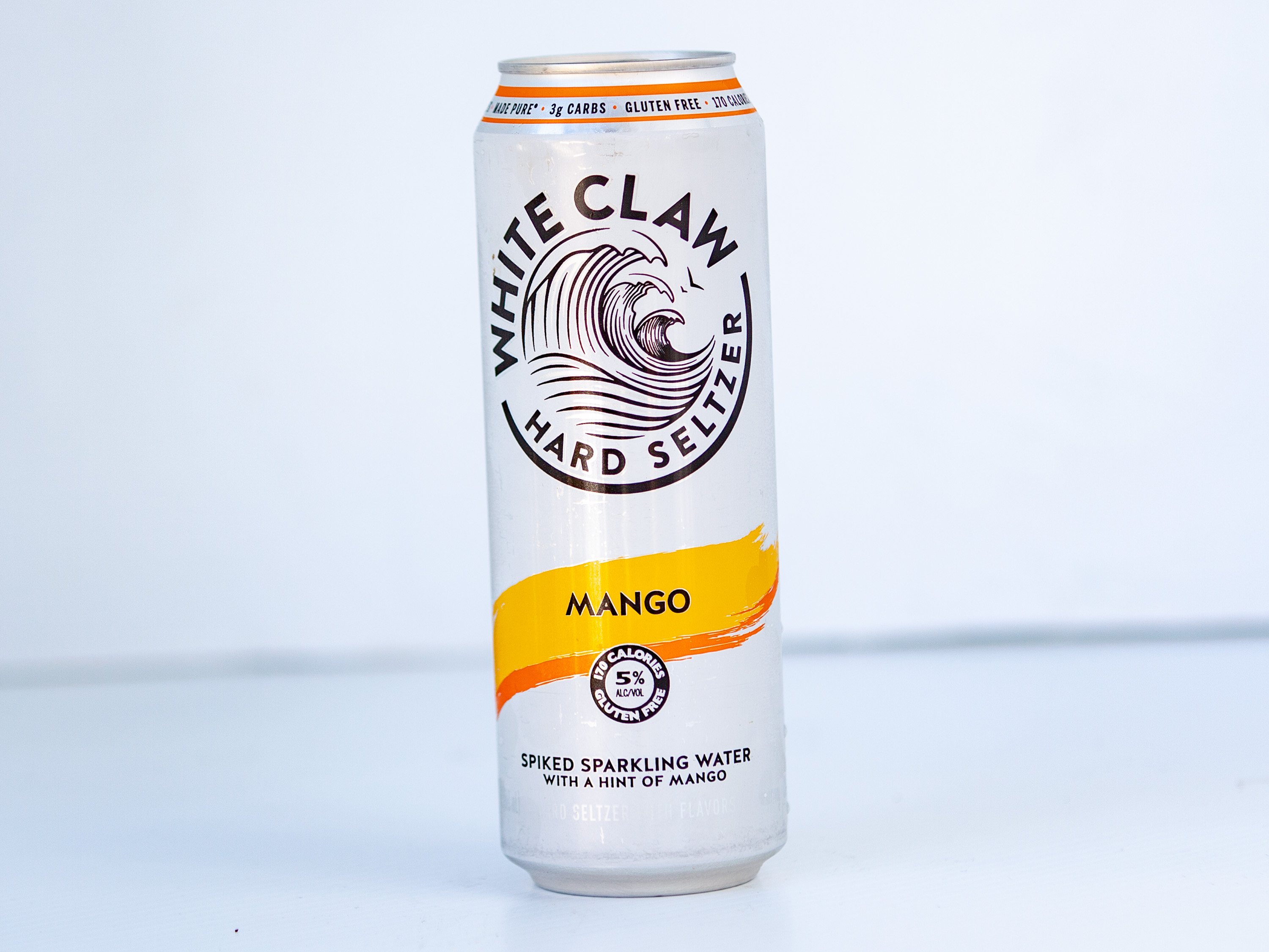 Order White claw | mango 19oz  food online from Sandpiper Liquors store, Summerland on bringmethat.com