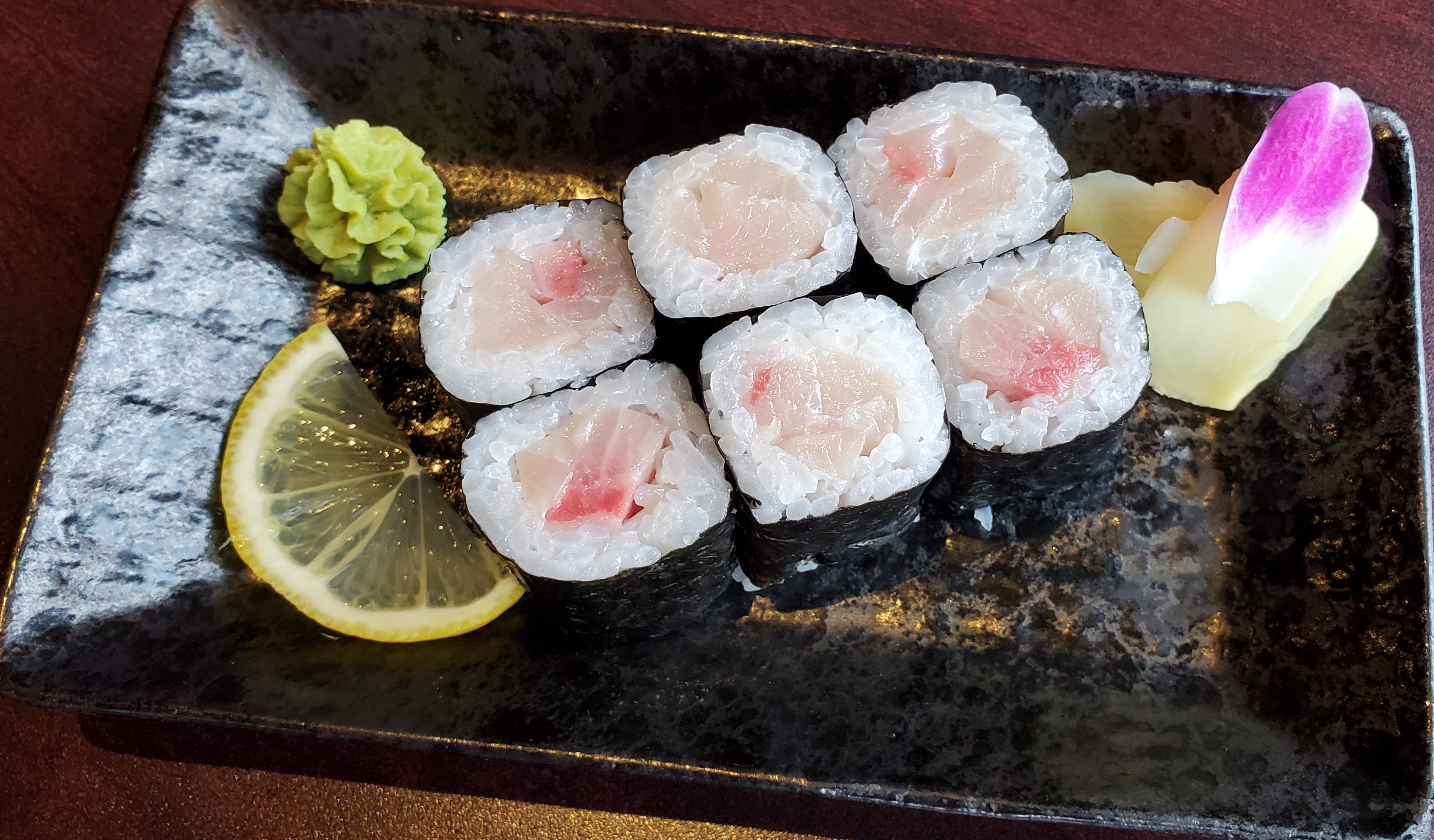Order Yellowtail Roll food online from Tsui Sushi Bar store, Seattle on bringmethat.com
