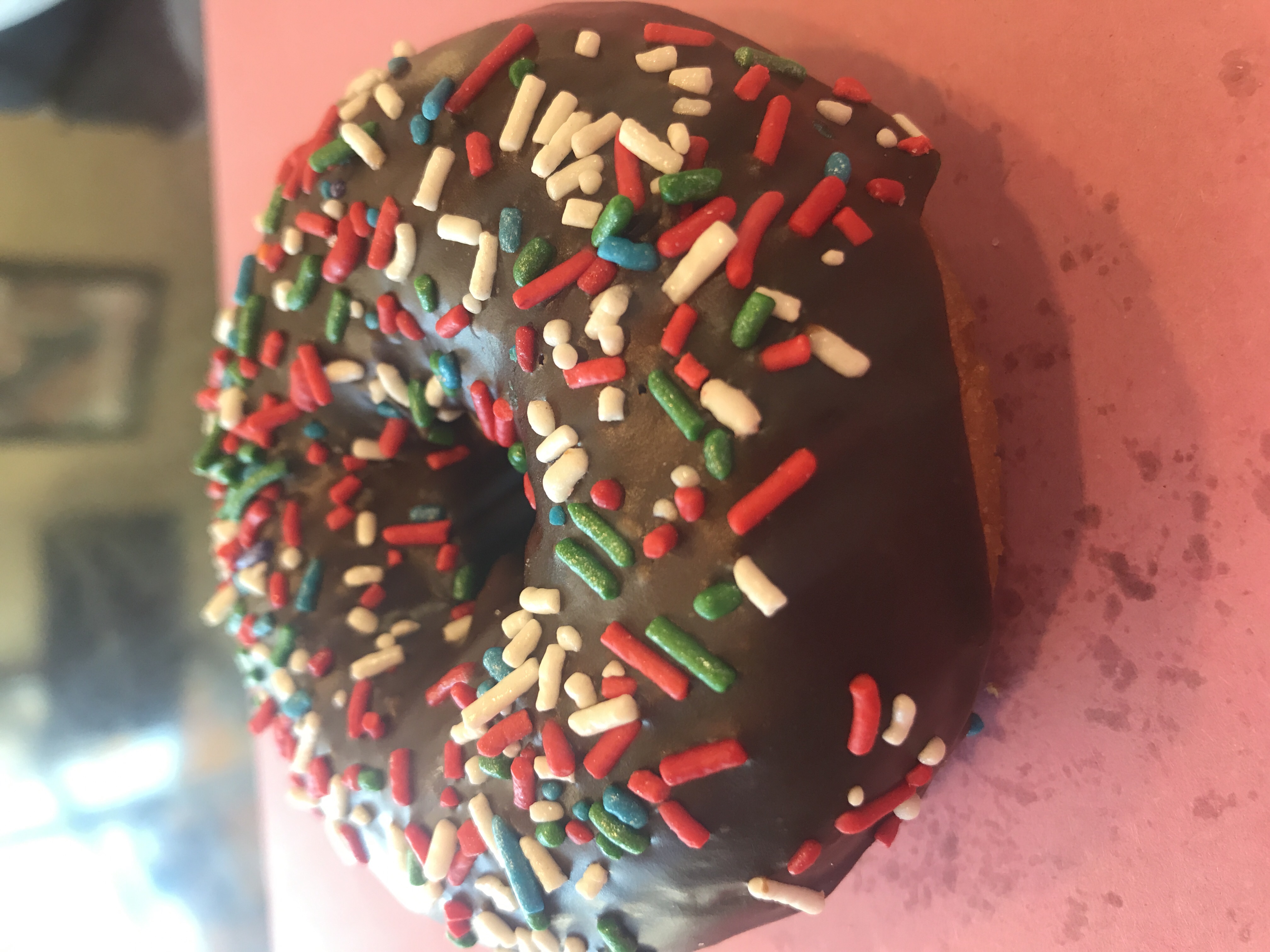 Order White Cake Donut with Chocolate Icing and Rainbow Sprinkles food online from Angel Panama Lane Donuts store, Bakersfield on bringmethat.com