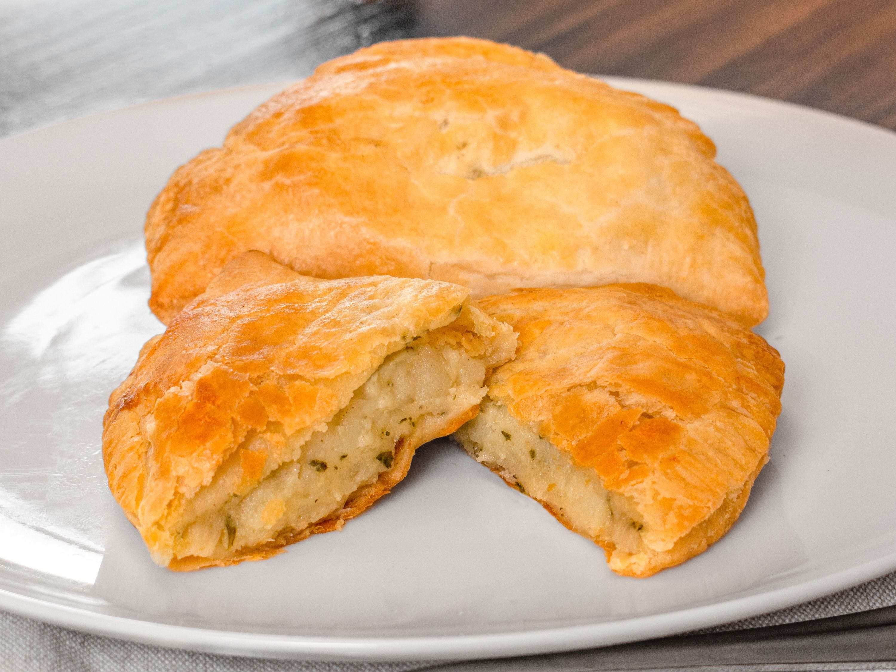 Order Cheese, Onion & Potato Pasty - Pastries food online from Kensington Pies store, East Meadow on bringmethat.com