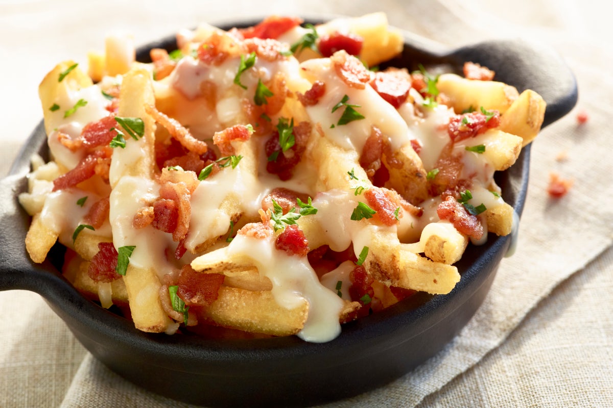 Order NEW! Loaded Cheese Fries food online from Ruby Tuesdays store, Evans on bringmethat.com