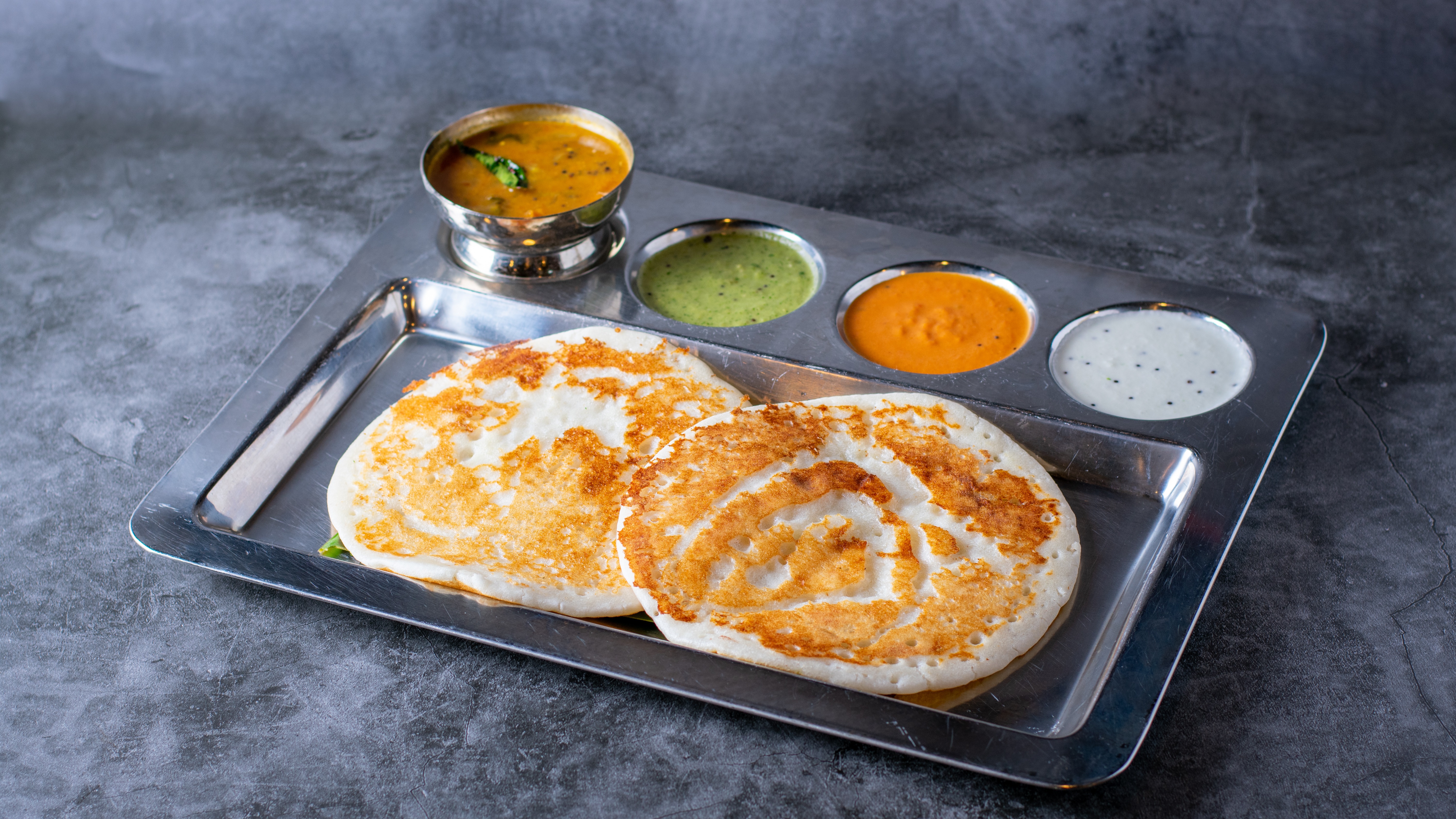 Order Plain Uthappam  - 2 Pieces food online from Sangam Chettinad Indian Cuisine store, Austin on bringmethat.com