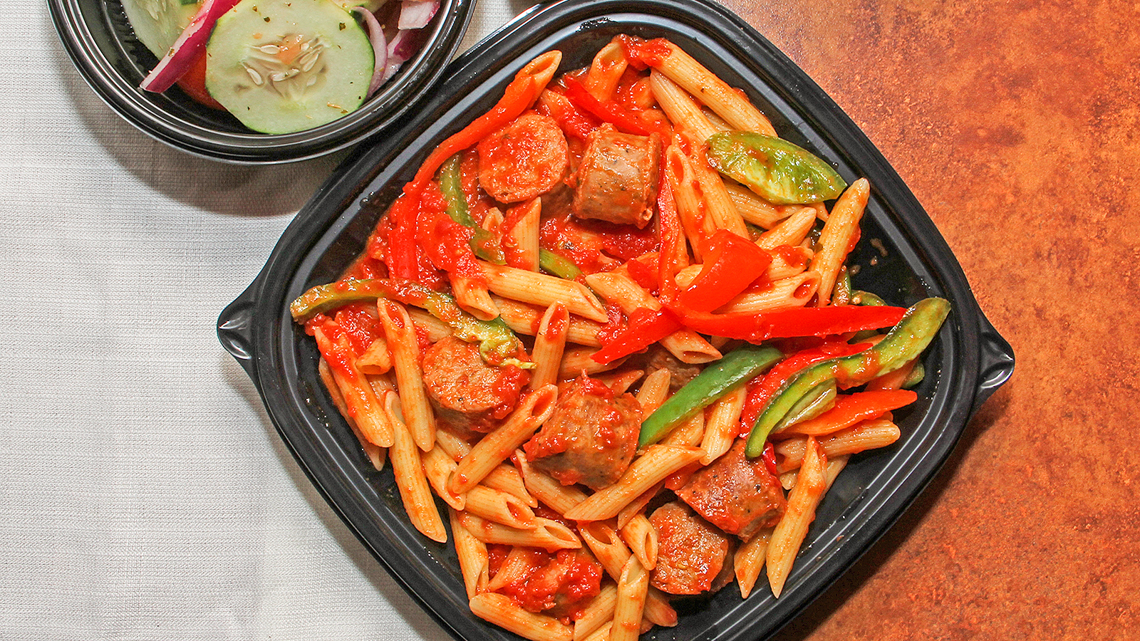 Order Pasta with Sausage and Peppers Marinara, Includes Garlic Roll food online from Tony & Bruno store, Northbrook on bringmethat.com