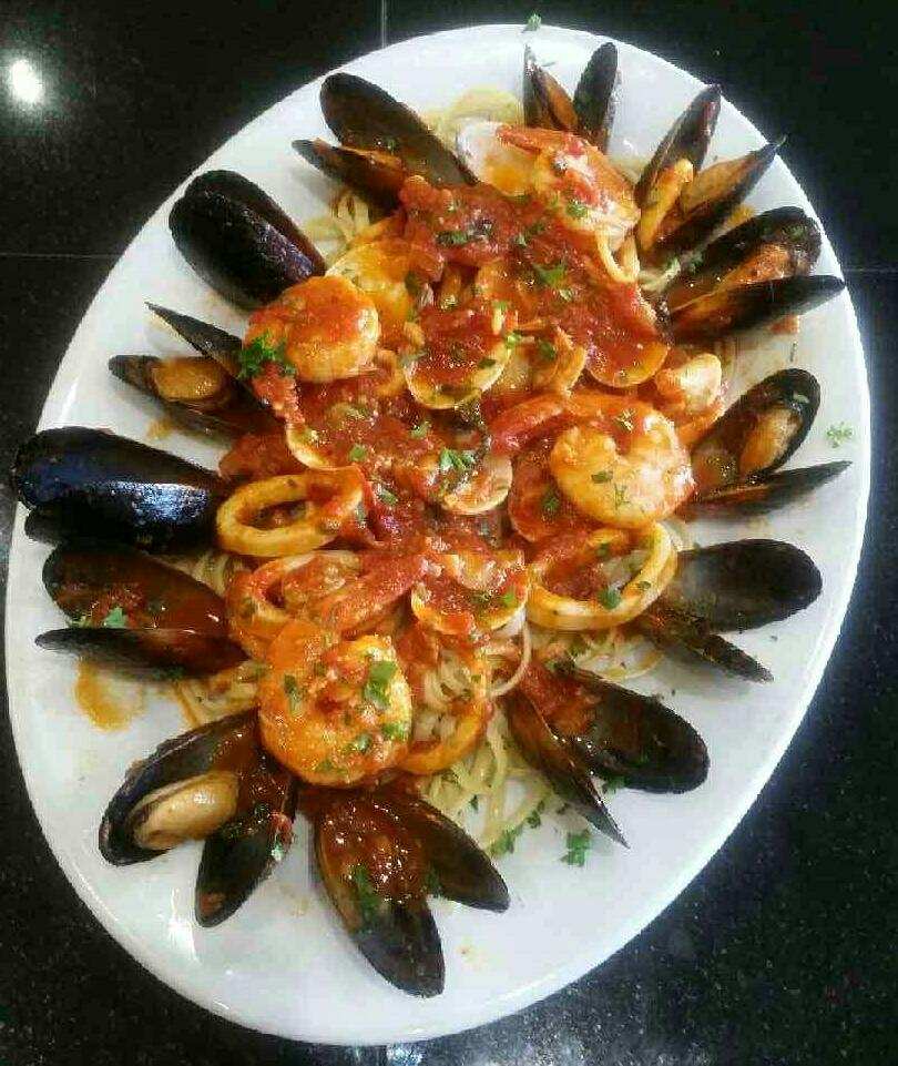 Order Seafood Pescatore over Linguine Dinner food online from Pasta On Time store, Levittown on bringmethat.com