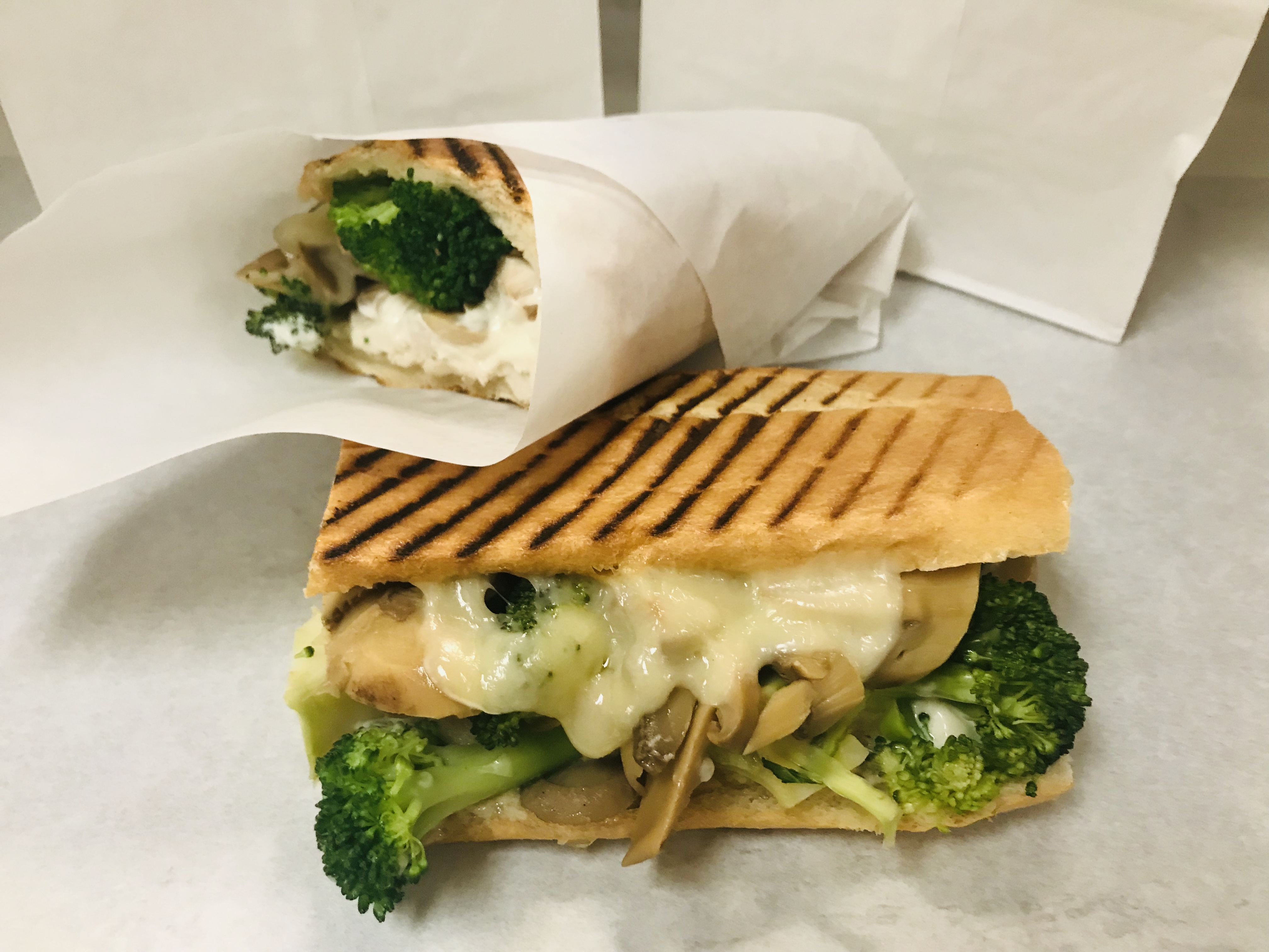 Order Hot Chicken Broccoli Mushroom Sandwich food online from Le Diplomate Cafe store, Irvine on bringmethat.com
