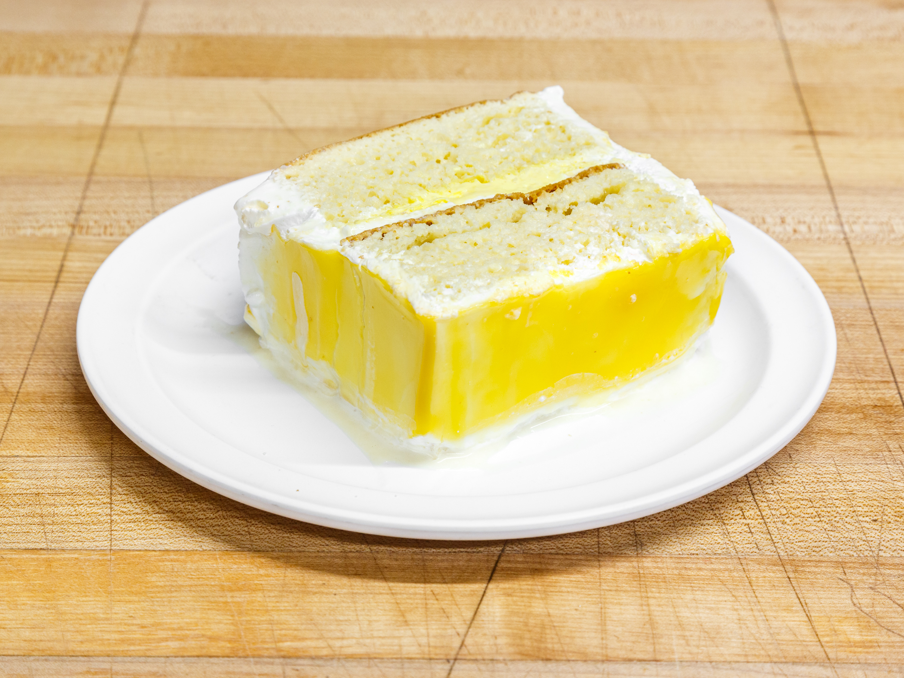 Order Mango Tres Leches Cake Slice food online from Panaderia Y Pasteleria store, Mableton on bringmethat.com