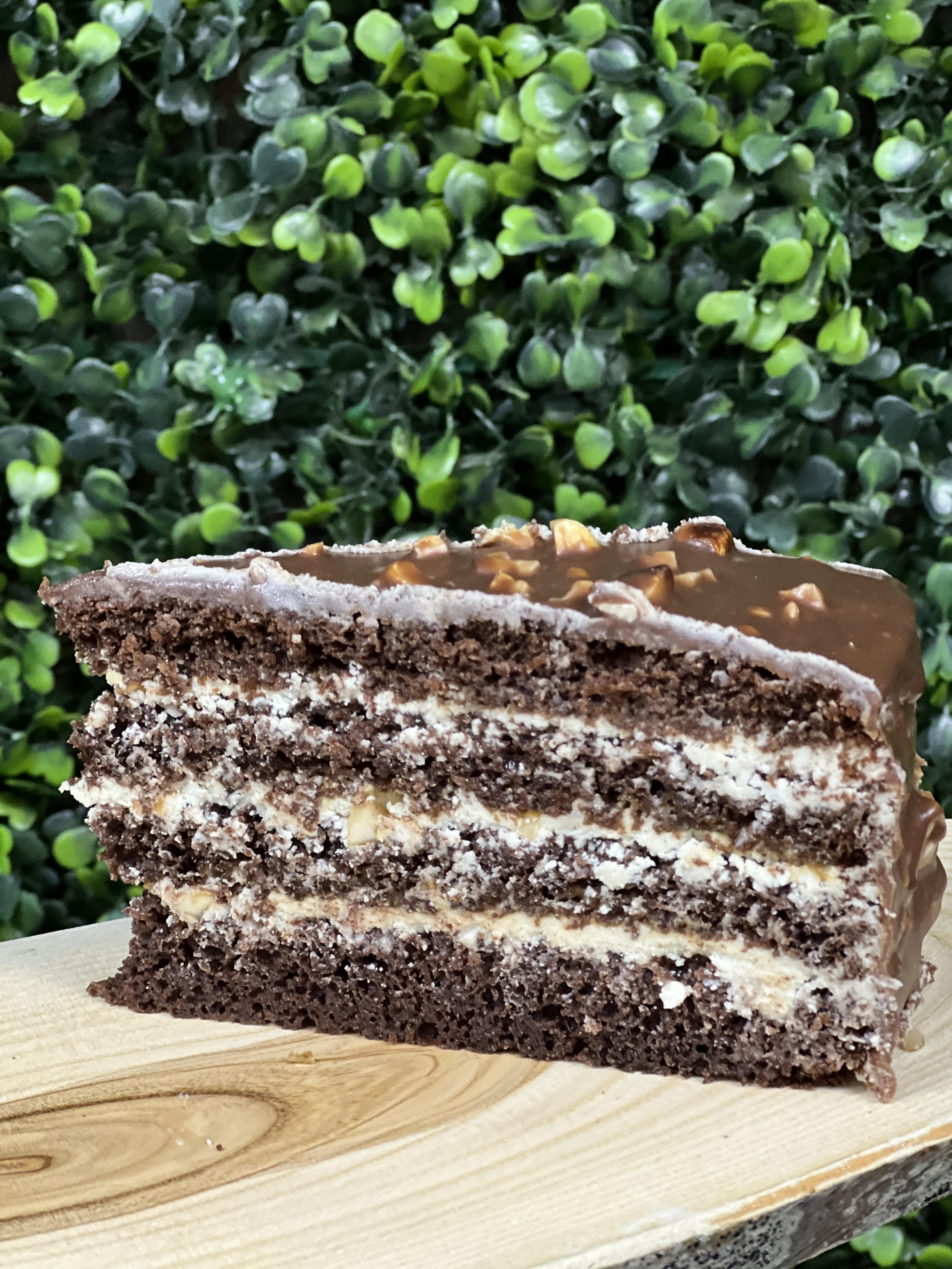 Order Snickers sliced Cake food online from Ossys Bakery store, Glendale on bringmethat.com
