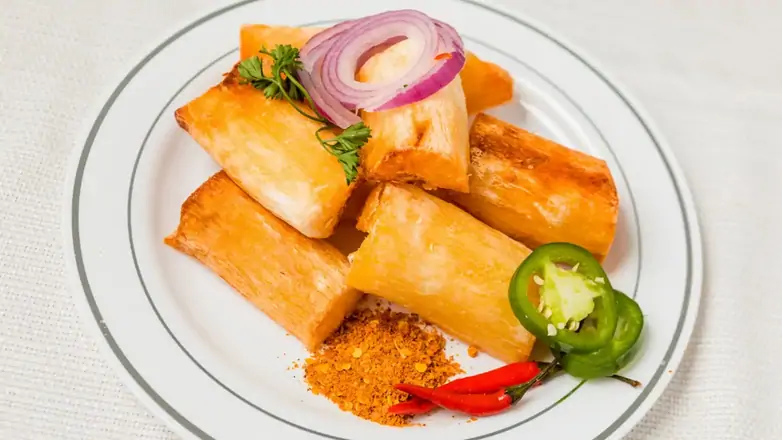 Order Fried Cassava (Yuka) food online from Hajara's Kitchen & Suya Supply store, Woodbridge on bringmethat.com