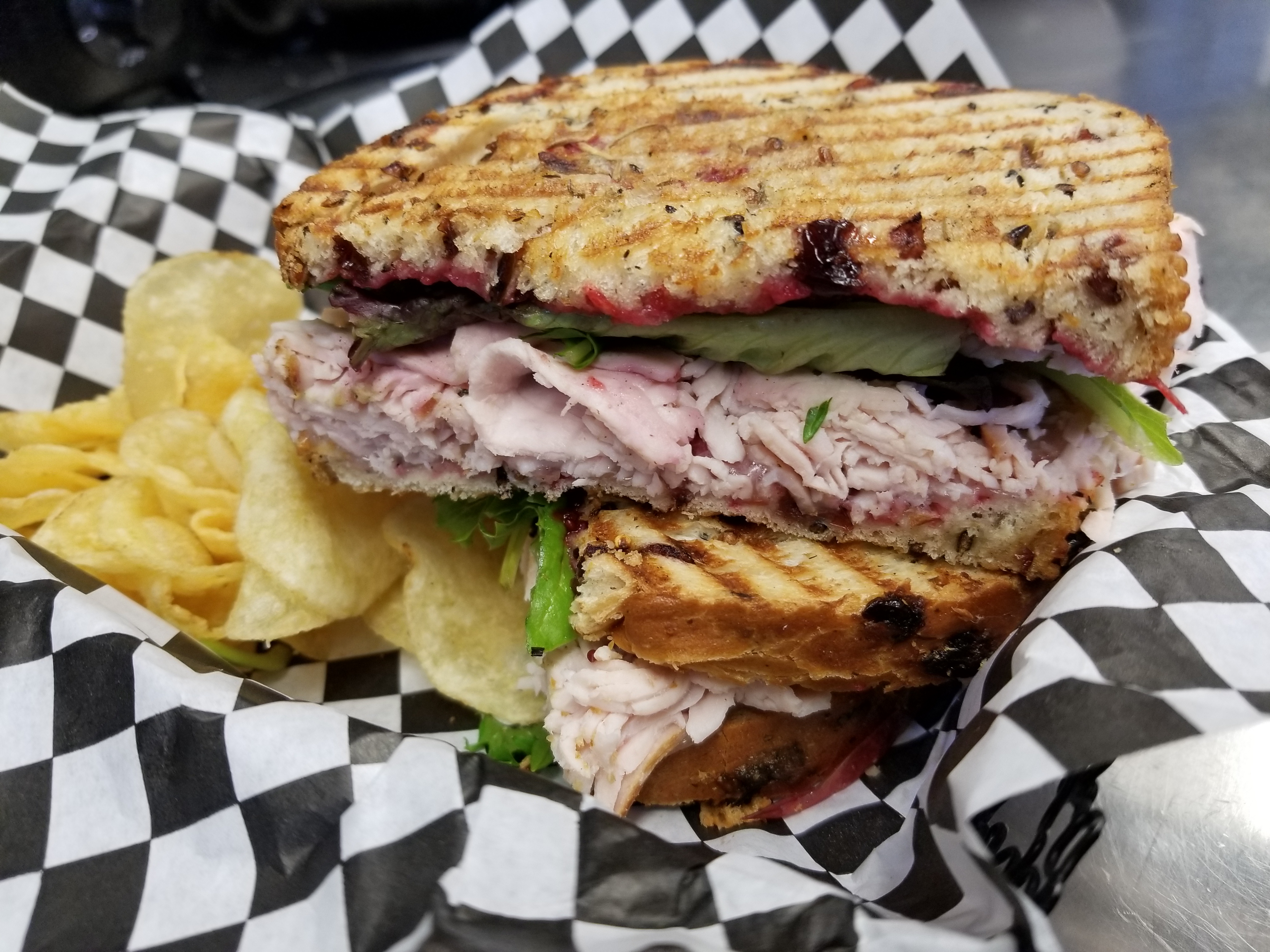 Order Turkey Cranberry Panini food online from Daily Dose Cafe and Espresso store, Minneapolis on bringmethat.com