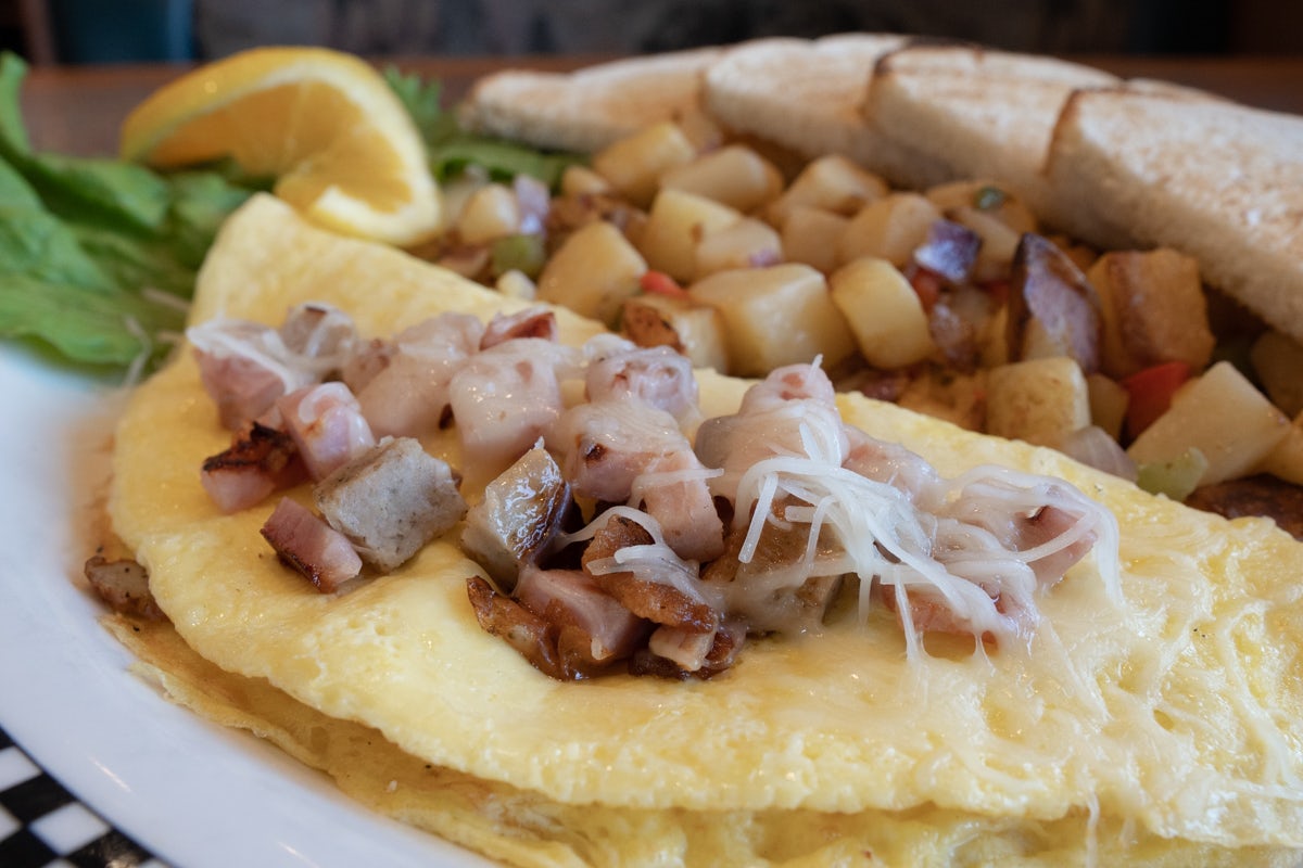 Order Bruce's Meat Lover's Omelette food online from Black Bear Diner store, Colorado Springs on bringmethat.com