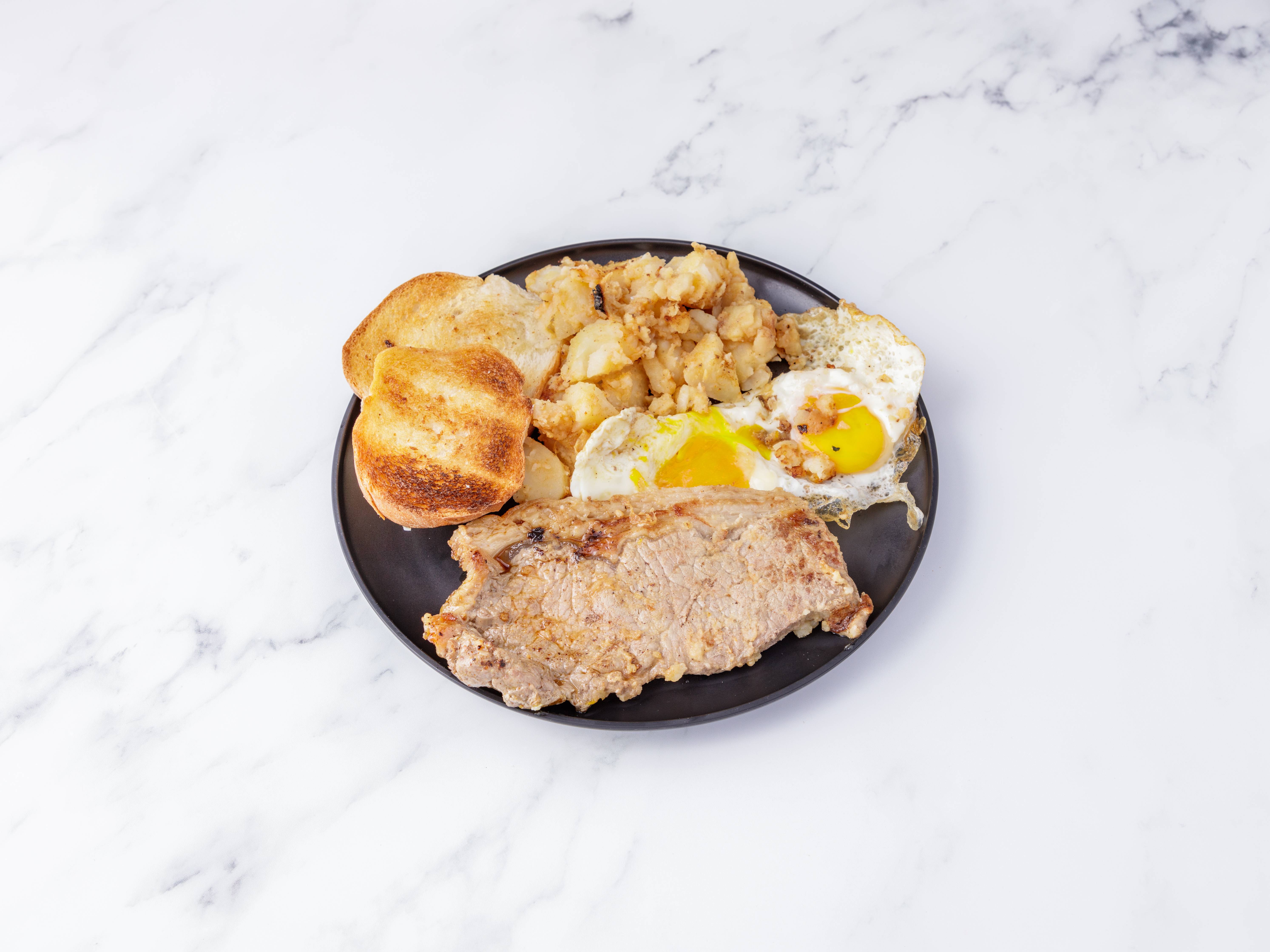 Order 2 Eggs, NY Strip Steak, Home Fries and Toast food online from The Old Serpico store, Syracuse on bringmethat.com