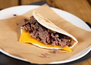 Order Brisket & Cheese Taco food online from Dickey's Barbecue Pit store, Broomfield on bringmethat.com