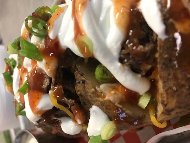Order Loaded Baked Potato food online from Champs Smokehouse Bbq store, Bakersfield on bringmethat.com