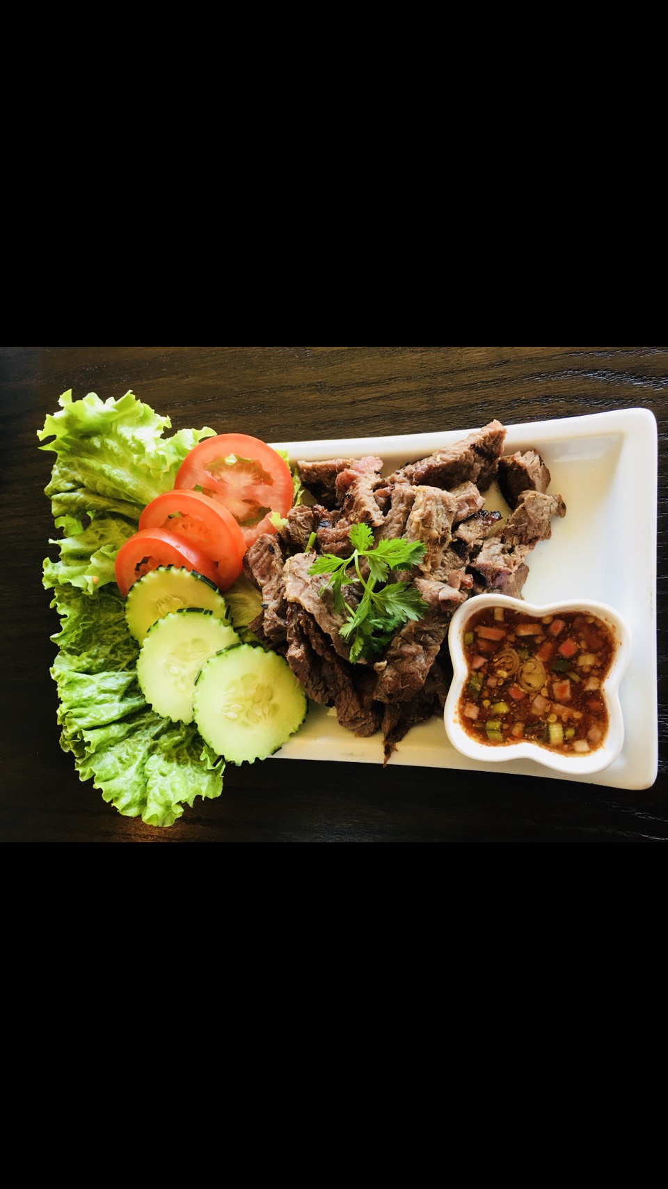 Order 41. Crying Tiger pork food online from Swanya Thai Cuisine store, Culver City on bringmethat.com