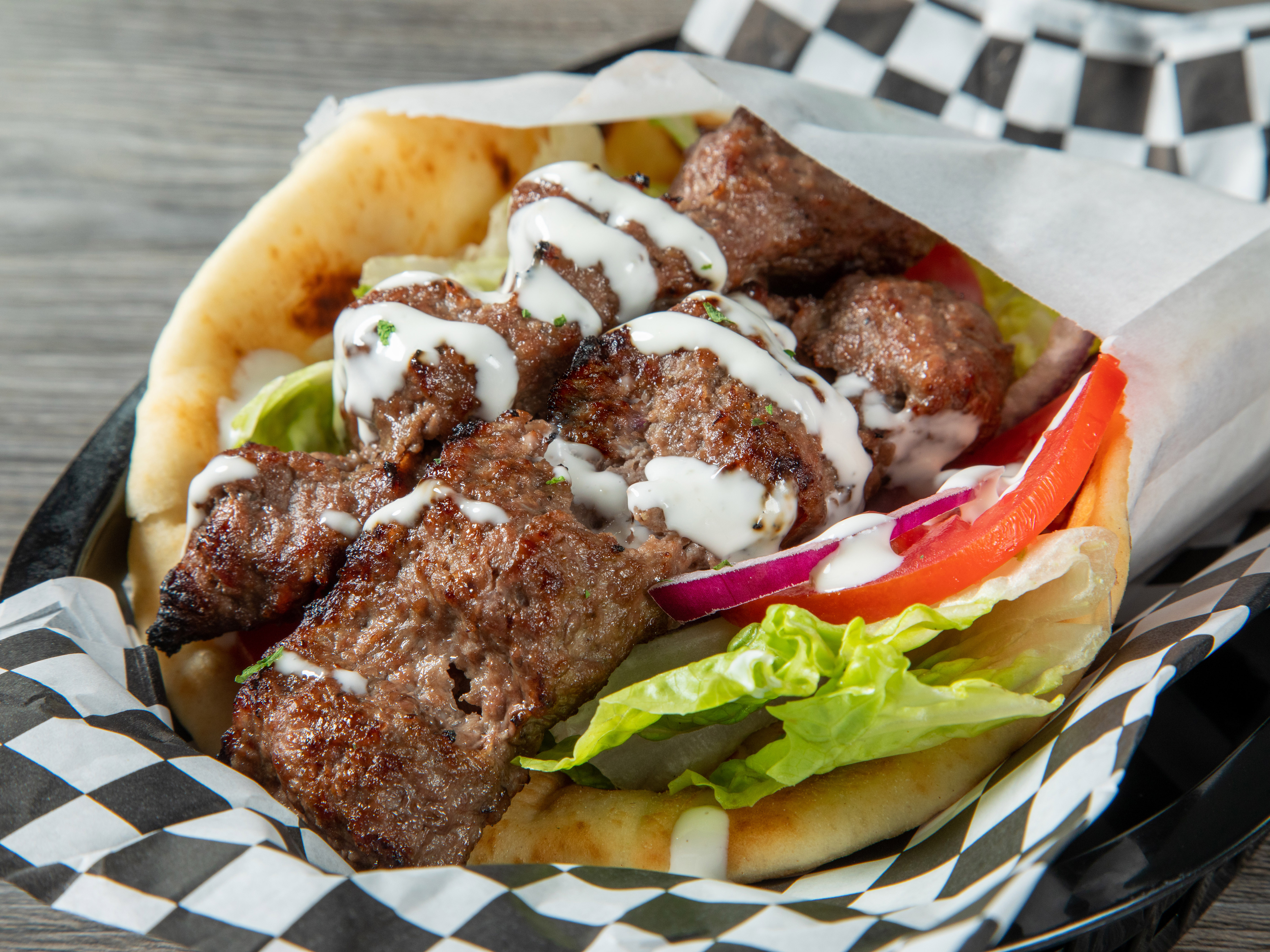 Order Ground Beef Koobideh Kabob WRAP. Specify Pita or tortilla food online from Kabob Cafe store, Foothill Ranch on bringmethat.com