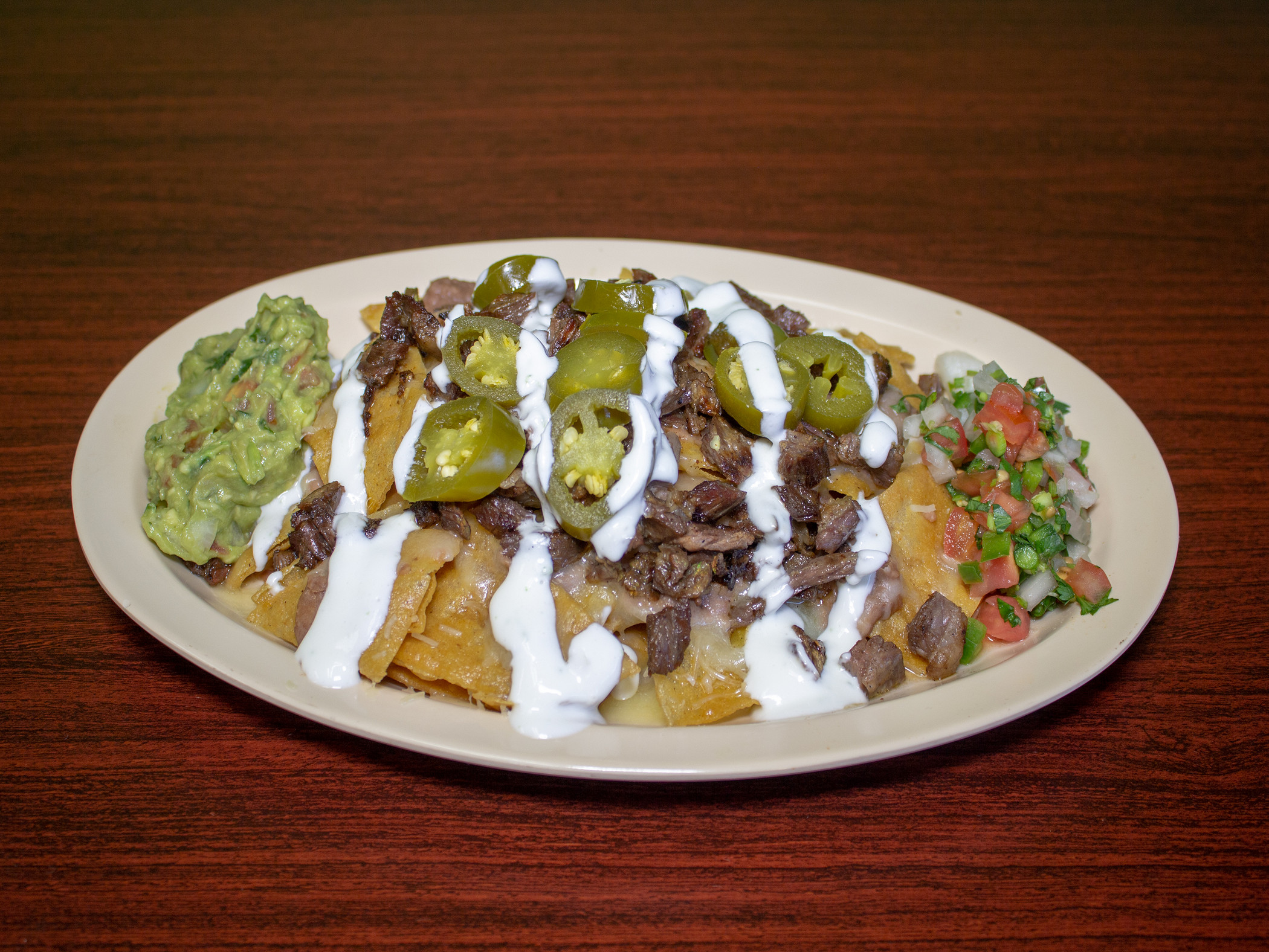 Order Asada Nacho food online from Marcos Tacos & Catering store, Franklin Park on bringmethat.com