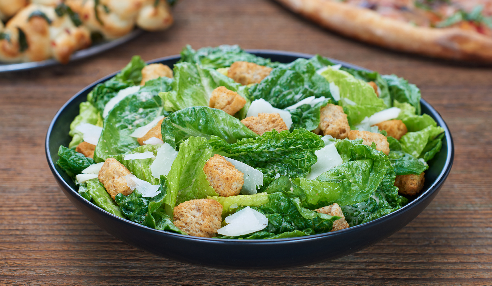 Order Caesar Salad food online from Flippin Pizza store, Alpharetta on bringmethat.com