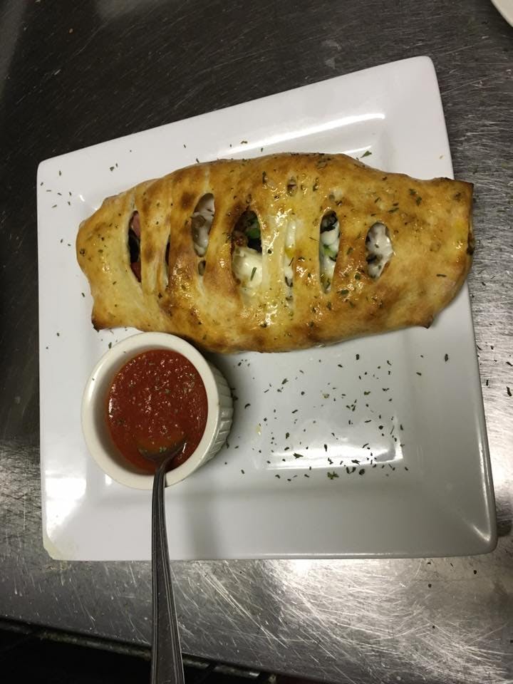 Order Spinach Calzone - Calzone food online from Macaluso's Italian Restaurant store, Fort Worth on bringmethat.com